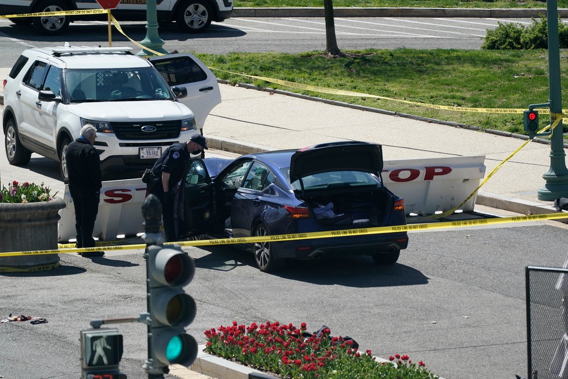 U.S. Capitol Police officers stand near a car that crashed into a barrier on Capitol Hill in Washington, Friday, April 2, 2021. (AP Photo/J. Scott Applewhite) U.S. Capitol Police officers stand near a car that crashed into a barrier on Capitol Hill in Washington, Friday, April 2, 2021. (AP Photo/J. Scott Applewhite)