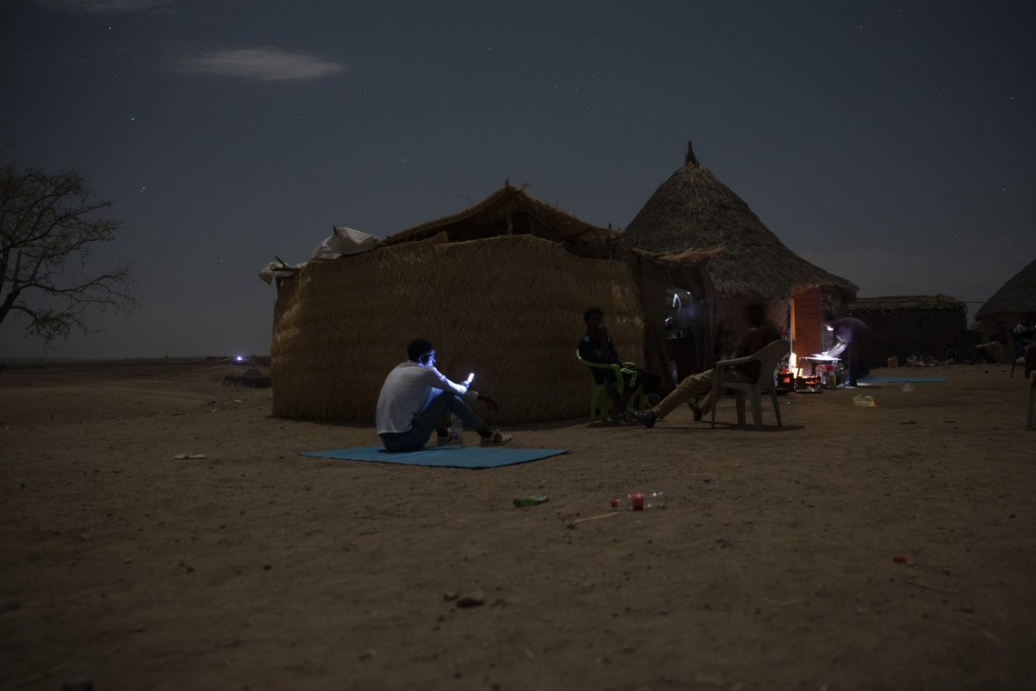 Tigrayan refugees who fled the conflict in the Ethiopia's Tigray try to find a network signal for their mobile phones in Hamdayet, eastern Sudan, near the border with Ethiopia, on March 23, 2021. For months, it has been the Tigrayans' word against that of the government in Ethiopia, Africa's second most populous country and one of its most powerful. But now, for the first time, there is official proof of what is being called ethnic cleansing in the form of identity cards smuggled across the border into this Sudanese border post and confirmed to The Associated Press by more than a half-dozen refugees from different communities. (AP Photo/Nariman El-Mofty) Tigrayan refugees who fled the conflict in the Ethiopia's Tigray try to find a network signal for their mobile phones in Hamdayet, eastern Sudan, near the border with Ethiopia, on March 23, 2021. For months, it has been the Tigrayans' word against that of the government in Ethiopia, Africa's second most populous country and one of its most powerful. But now, for the first time, there is official proof of what is being called ethnic cleansing in the form of identity cards smuggled across the border into this Sudanese border post and confirmed to The Associated Press by more than a half-dozen refugees from different communities. (AP Photo/Nariman El-Mofty)