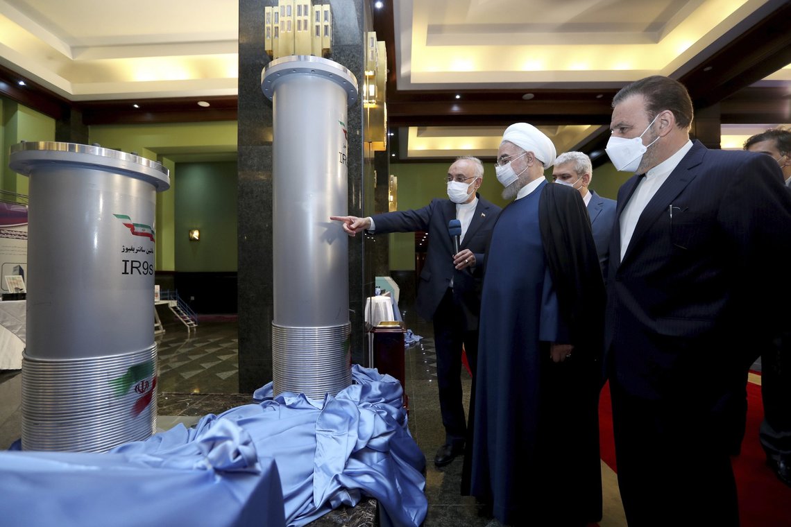 In this photo released by the official website of the office of the Iranian Presidency, President Hassan Rouhani, second right, listens to head of the Atomic Energy Organization of Iran Ali Akbar Salehi while visiting an exhibition of Iran's new nuclear achievements in Tehran, Iran, Saturday, April 10, 2021. Iran said Saturday it has begun mechanical tests on its newest advanced nuclear centrifuge, even as the five world powers that remain in a foundering 2015 nuclear deal with Iran attempt to bring the U.S. back into the agreement. (Iranian Presidency Office via AP) In this photo released by the official website of the office of the Iranian Presidency, President Hassan Rouhani, second right, listens to head of the Atomic Energy Organization of Iran Ali Akbar Salehi while visiting an exhibition of Iran's new nuclear achievements in Tehran, Iran, Saturday, April 10, 2021. Iran said Saturday it has begun mechanical tests on its newest advanced nuclear centrifuge, even as the five world powers that remain in a foundering 2015 nuclear deal with Iran attempt to bring the U.S. back into the agreement. (Iranian Presidency Office via AP)