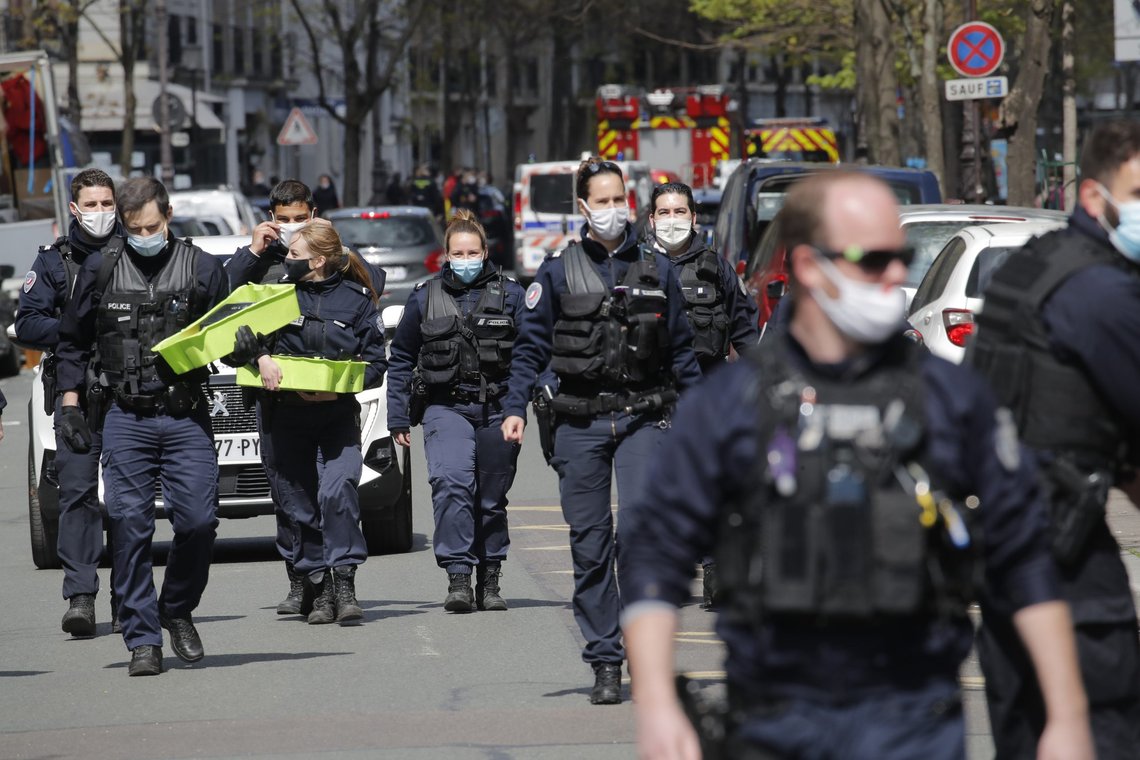 Police officers leave the scene after a shooting Monday, April 12, 2021 in Paris. A gunman has shot two people in front of a hospital in Paris and the attacker fled on a motorcycle. (AP Photo/Christophe Ena) Police officers leave the scene after a shooting Monday, April 12, 2021 in Paris. A gunman has shot two people in front of a hospital in Paris and the attacker fled on a motorcycle. (AP Photo/Christophe Ena)