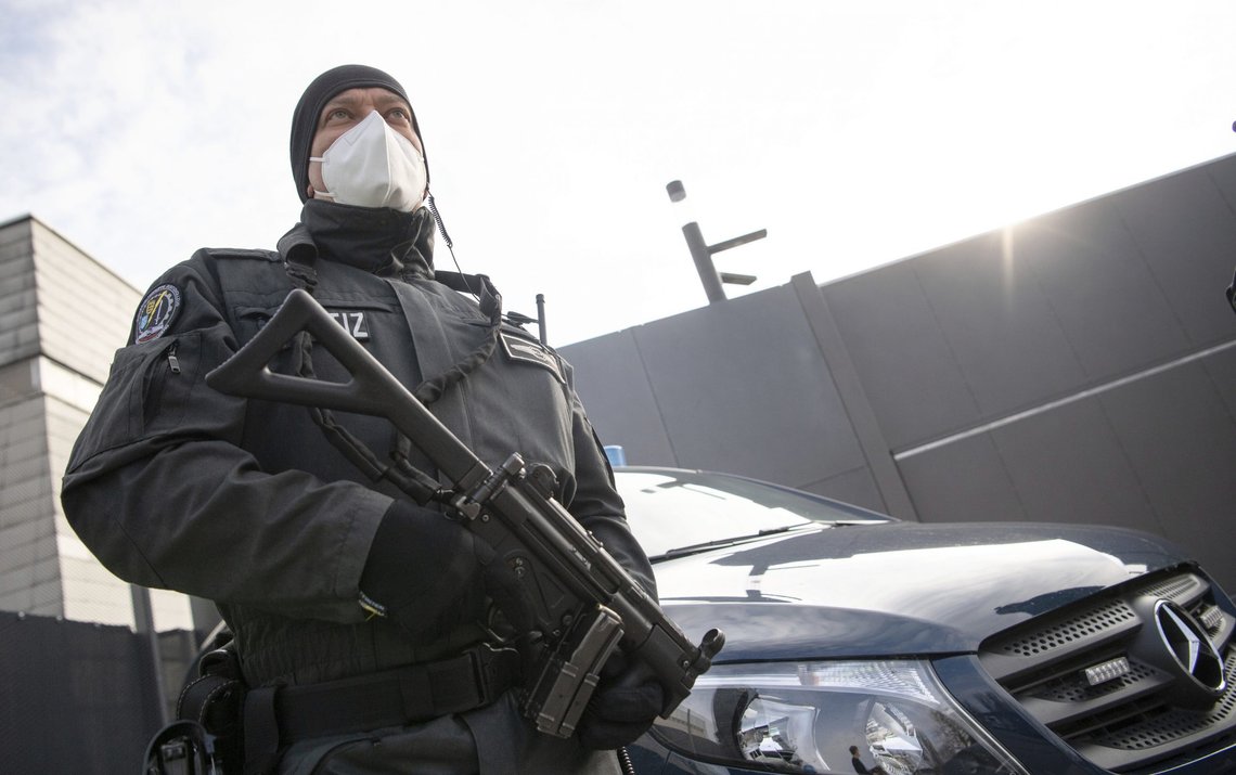 An armed court officer stands in front of an entrance to the grounds of the Higher Regional Court in Stuttgart-Stammheim, Germany, Tuesday, April 13, 2021. Twelve suspected members and supporters of the right-wing terrorist group "Gruppe S." must answer to the Stuttgart Higher Regional Court in a state protection trial. (Photo/AP via Pool) An armed court officer stands in front of an entrance to the grounds of the Higher Regional Court in Stuttgart-Stammheim, Germany, Tuesday, April 13, 2021. Twelve suspected members and supporters of the right-wing terrorist group "Gruppe S." must answer to the Stuttgart Higher Regional Court in a state protection trial. (Photo/AP via Pool)