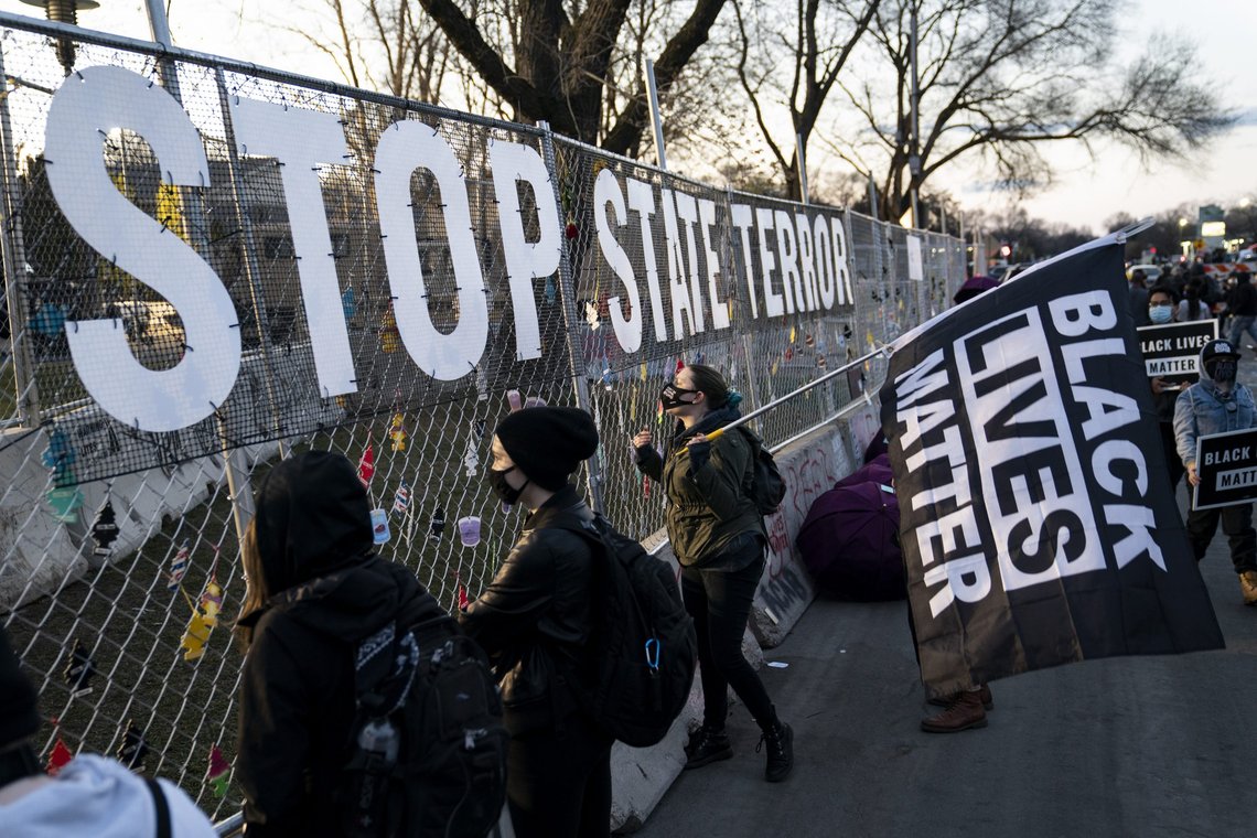A sign reading "Stop state terror" is hung on a perimeter security fence as protest over the fatal shooting of Daunte Wright by a police officer during a traffic stop continue, outside the Brooklyn Center Police Department, Saturday, April 17, 2021, in Brooklyn Center, Minn. (AP Photo/John Minchillo) A sign reading "Stop state terror" is hung on a perimeter security fence as protest over the fatal shooting of Daunte Wright by a police officer during a traffic stop continue, outside the Brooklyn Center Police Department, Saturday, April 17, 2021, in Brooklyn Center, Minn. (AP Photo/John Minchillo)