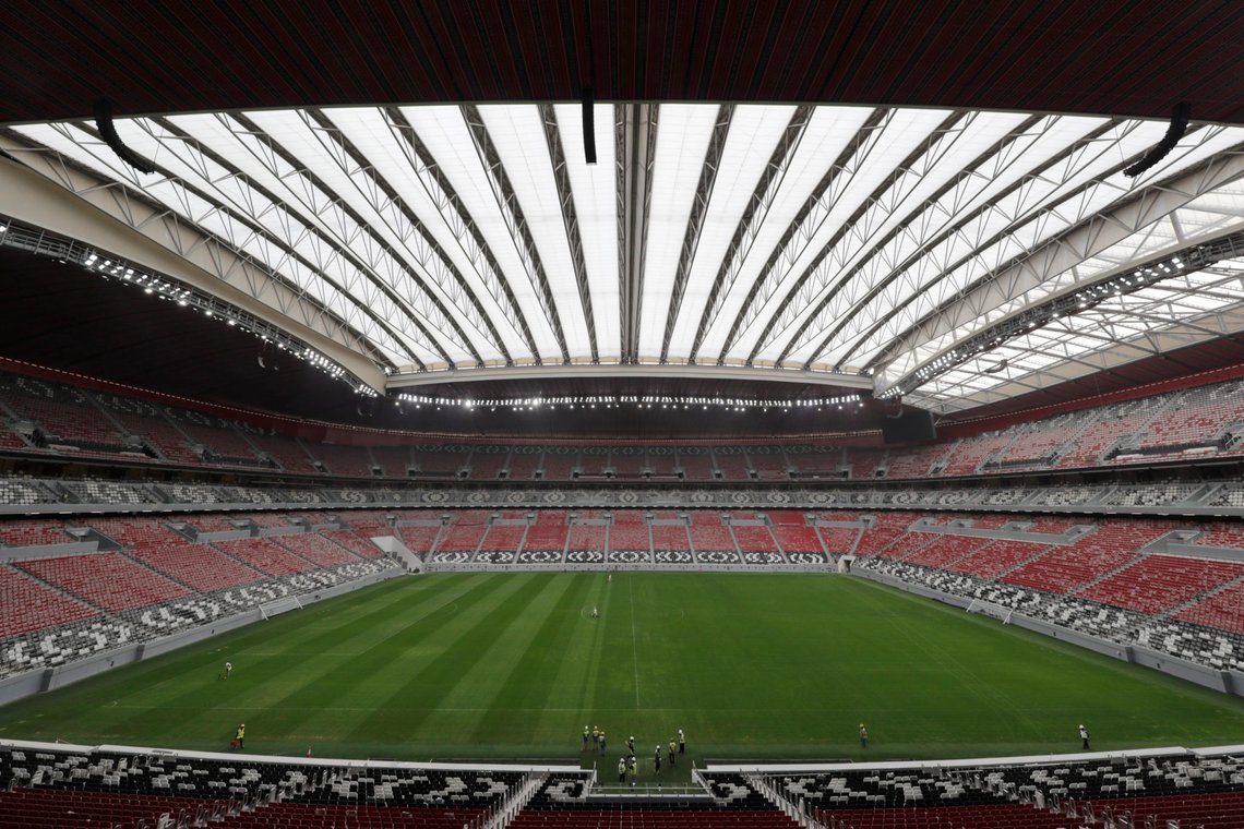 FILE - This Tuesday, Dec. 17, 2019 file photo shows the Al Bayt Stadium, one of the 2022 World Cup stadiums, in Al Khor, about 50 kilometers (30 miles) north of Doha, Qatar. The Al Bayt 60,000 seats stadium with Qatari tent shaped facade has a retractable roof. FIFA on Monday Dec. 7, 2020, held the draw to determine the European qualifying groups for the 2022 World Cup in Qatar, with 13 slots at the tournament available for teams from the continent. (AP Photo/Hassan Ammar, File) FILE - This Tuesday, Dec. 17, 2019 file photo shows the Al Bayt Stadium, one of the 2022 World Cup stadiums, in Al Khor, about 50 kilometers (30 miles) north of Doha, Qatar. The Al Bayt 60,000 seats stadium with Qatari tent shaped facade has a retractable roof. FIFA on Monday Dec. 7, 2020, held the draw to determine the European qualifying groups for the 2022 World Cup in Qatar, with 13 slots at the tournament available for teams from the continent. (AP Photo/Hassan Ammar, File)