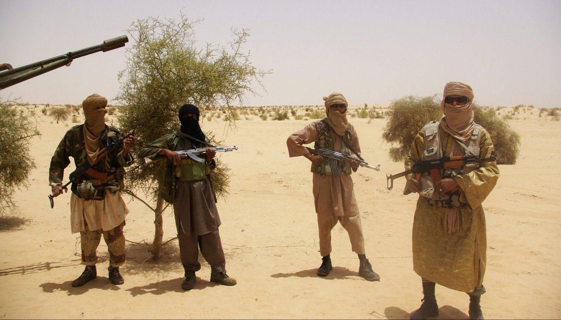 FILE - In this Tuesday, April 24, 2012 file photo, fighters from Islamist group Ansar Dine stand guard during a hostage handover, in the desert outside Timbuktu, Mali. The movie ?Timbuktu? , an Oscar nominee, explores Islamic extremism and can also serve as an exploration of the harsh ideology of Boko Haram militants in Nigeria, the Islamic State in Iraq and Syria and the slain gunmen who attacked the satirical weekly Charlie Hebdo and a kosher supermarket in Paris. A slain assailant suspected in Copenhagen attacks that killed two people this weekend may have been inspired by Islamic militants, Danish authorities said.(AP Photo / File) FILE - In this Tuesday, April 24, 2012 file photo, fighters from Islamist group Ansar Dine stand guard during a hostage handover, in the desert outside Timbuktu, Mali. The movie ?Timbuktu? , an Oscar nominee, explores Islamic extremism and can also serve as an exploration of the harsh ideology of Boko Haram militants in Nigeria, the Islamic State in Iraq and Syria and the slain gunmen who attacked the satirical weekly Charlie Hebdo and a kosher supermarket in Paris. A slain assailant suspected in Copenhagen attacks that killed two people this weekend may have been inspired by Islamic militants, Danish authorities said.(AP Photo / File)