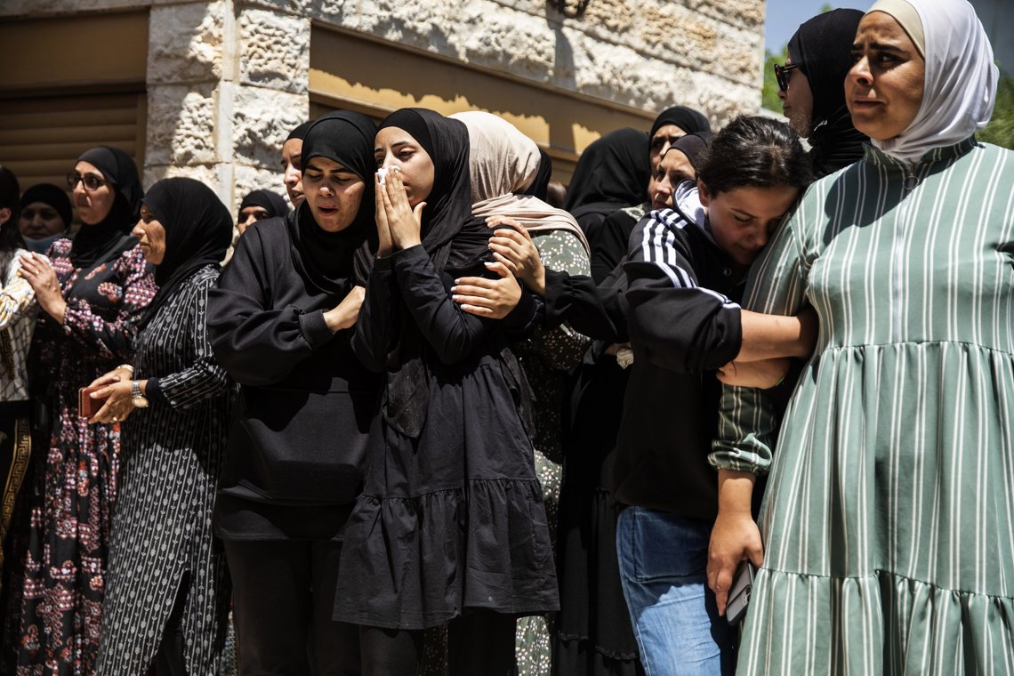 Mourners react during the funeral of Israeli Arab Khalil Awaad and his daughter Nadine, 16, in the village of Dahmash near the Israeli city of Lod, Wednesday, May 12, 2021. Early Wednesday a rocket fired from Gaza Strip hit their house and killed both father and his daughter. (AP Photos/Heidi Levine) Mourners react during the funeral of Israeli Arab Khalil Awaad and his daughter Nadine, 16, in the village of Dahmash near the Israeli city of Lod, Wednesday, May 12, 2021. Early Wednesday a rocket fired from Gaza Strip hit their house and killed both father and his daughter. (AP Photos/Heidi Levine)