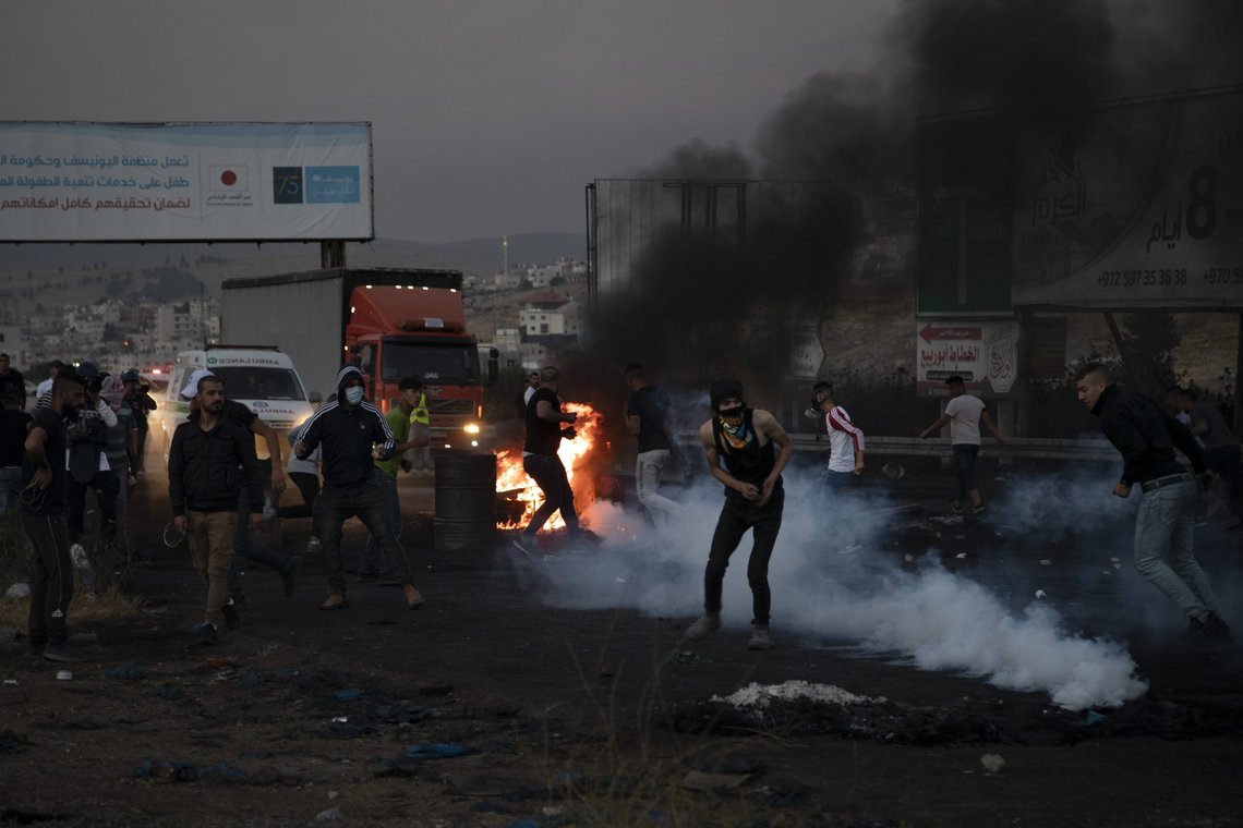 Palestinians clash with Israeli forces at the Hawara checkpoint, south of the West Bank city of Nablus, Sunday, May 16, 2021. (AP Photo/Majdi Mohammed) Palestinians clash with Israeli forces at the Hawara checkpoint, south of the West Bank city of Nablus, Sunday, May 16, 2021. (AP Photo/Majdi Mohammed)