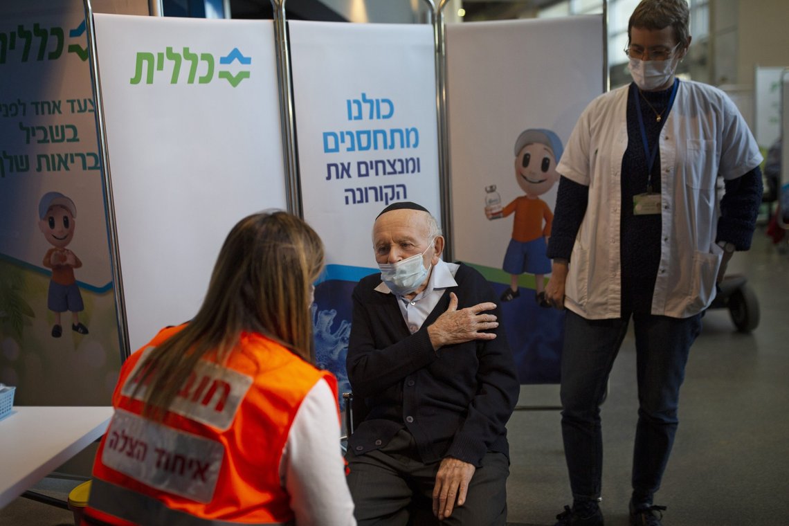 FILE - In this Jan. 21, 2021 file photo, Holocaust survivor Joseph Zalman Kleinman gestures to the arm he prefers to receive the second dose of the Pfizer vaccine for COVID-19, in Jerusalem. Kleinman who lived through through the Auschwitz death camp and testified against Adolf Eichmann in the Nazi commander's trial in Jerusalem, died Tuesday in Israel. He was 91. (AP Photo/Maya Alleruzzo, File) FILE - In this Jan. 21, 2021 file photo, Holocaust survivor Joseph Zalman Kleinman gestures to the arm he prefers to receive the second dose of the Pfizer vaccine for COVID-19, in Jerusalem. Kleinman who lived through through the Auschwitz death camp and testified against Adolf Eichmann in the Nazi commander's trial in Jerusalem, died Tuesday in Israel. He was 91. (AP Photo/Maya Alleruzzo, File)