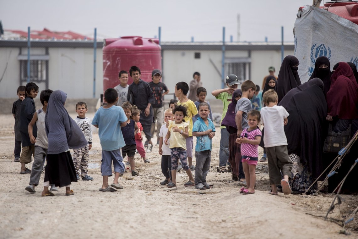 Women and children gather in front their tents at al-Hol camp that houses some 60,000 refugees, including families and supporters of the Islamic State group, many of them foreign nationals, in Hasakeh province, Syria, Saturday, May 1, 2021. Kurdish officials say security has improved at the sprawling camp in northeast Syria, but concerns are growing of a coronavirus outbreak in the facility. (AP Photo/Baderkhan Ahmad) Women and children gather in front their tents at al-Hol camp that houses some 60,000 refugees, including families and supporters of the Islamic State group, many of them foreign nationals, in Hasakeh province, Syria, Saturday, May 1, 2021. Kurdish officials say security has improved at the sprawling camp in northeast Syria, but concerns are growing of a coronavirus outbreak in the facility. (AP Photo/Baderkhan Ahmad)