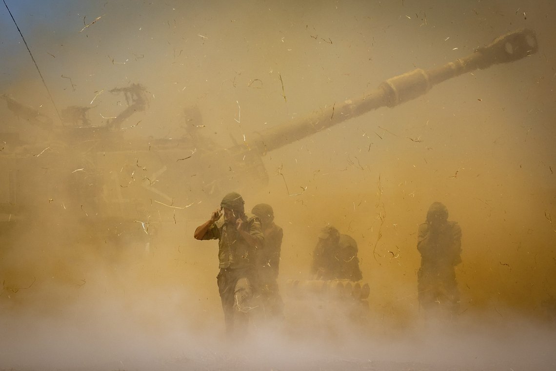 An Israeli artillery unit fires toward targets in Gaza Strip, at the Israeli Gaza border, Wednesday, May 12, 2021. (AP Photo/Yonatan Sindel) An Israeli artillery unit fires toward targets in Gaza Strip, at the Israeli Gaza border, Wednesday, May 12, 2021. (AP Photo/Yonatan Sindel)