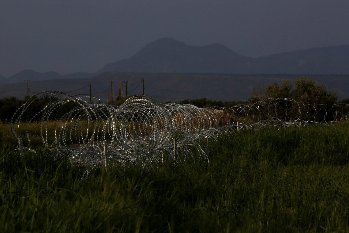 Razor wire is seen along the southern side of a U.N buffer zone that cuts across the ethnically divided Cyprus, near village of Astromeritis, Tuesday, March 9, 2021. The government of ethnically split Cyprus has come under fire over a decision to lay razor wire along a section of a U.N. controlled buffer zone it said is needed to stem migrant inflows from the island's breakaway north, with critics charging that the "ineffective" scheme only feeds partitionist perceptions amid a renewed push resume dormant peace talks. (AP Photo/Petros Karadjias) Razor wire is seen along the southern side of a U.N buffer zone that cuts across the ethnically divided Cyprus, near village of Astromeritis, Tuesday, March 9, 2021. The government of ethnically split Cyprus has come under fire over a decision to lay razor wire along a section of a U.N. controlled buffer zone it said is needed to stem migrant inflows from the island's breakaway north, with critics charging that the "ineffective" scheme only feeds partitionist perceptions amid a renewed push resume dormant peace talks. (AP Photo/Petros Karadjias)