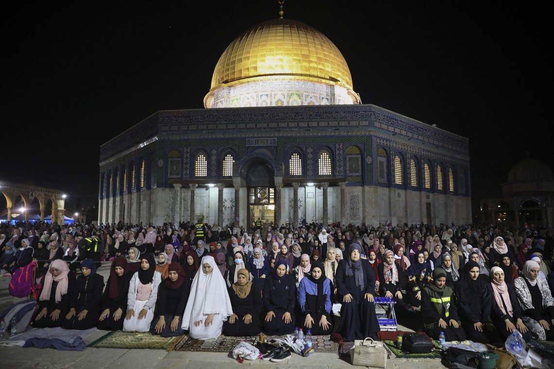 Palestinian Muslim worshippers pray during the Laylat al-Qadr, or the night of destiny, in the holy fasting month of Ramadan, in front of the Dome of the Rock Mosque at the Al Aqsa Mosque compound in Jerusalem's Old City Saturday, May 8, 2021. (AP Photo/Mahmoud Illean) Palestinian Muslim worshippers pray during the Laylat al-Qadr, or the night of destiny, in the holy fasting month of Ramadan, in front of the Dome of the Rock Mosque at the Al Aqsa Mosque compound in Jerusalem's Old City Saturday, May 8, 2021. (AP Photo/Mahmoud Illean)