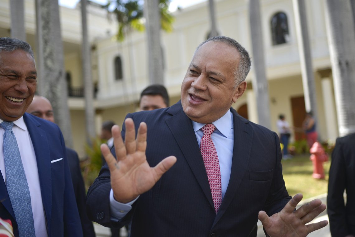 Diosdado Cabello, president of the National Constituent Assembly, jokes with lawmakers after giving a press conference at the National Assembly in Caracas, Venezuela, Wednesday, Jan. 8, 2020. A fight for control of the legislature comes as the opposition is struggling to regain its momentum, nearly a year after opposition leader Juan Guaido declared himself interim president of the nation. (AP Photo/Matias Delacroix) Diosdado Cabello, president of the National Constituent Assembly, jokes with lawmakers after giving a press conference at the National Assembly in Caracas, Venezuela, Wednesday, Jan. 8, 2020. A fight for control of the legislature comes as the opposition is struggling to regain its momentum, nearly a year after opposition leader Juan Guaido declared himself interim president of the nation. (AP Photo/Matias Delacroix)