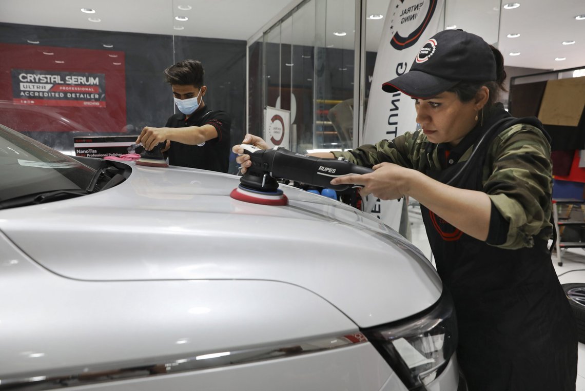 Iranian car detailer Maryam Roohani, right, and her brother Reza polish a car at a detailing shop in Tehran, Iran, April 18, 2021. Maryam Roohani has battled skeptics and stereotypes to live out her dream of working as a professional detailer. The auto industry remains male-dominated around the world, let alone in the tradition-bound Islamic Republic. (AP Photo/Vahid Salemi) Iranian car detailer Maryam Roohani, right, and her brother Reza polish a car at a detailing shop in Tehran, Iran, April 18, 2021. Maryam Roohani has battled skeptics and stereotypes to live out her dream of working as a professional detailer. The auto industry remains male-dominated around the world, let alone in the tradition-bound Islamic Republic. (AP Photo/Vahid Salemi)