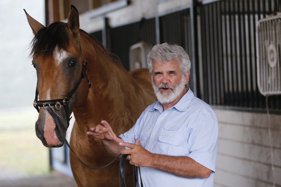 Dr. Robert Malone holds the reins of his stallion, Jade II Da Sernadinha, on his horse farm in Madison, Va., on Wednesday July 22, 2020. Malone, who serves as a consultant to a Pentagon-funded program that develops medications to protect American troops from biological threats, believed enough in famotidines efficacy and safety as a COVID-19 drug that, when he contracted the disease, he took it himself. He reported on his LinkedIn page that hed figured out the proper dose and became the first to take the drug to treat my own case." (AP Photo/Steve Helber) Dr. Robert Malone holds the reins of his stallion, Jade II Da Sernadinha, on his horse farm in Madison, Va., on Wednesday July 22, 2020. Malone, who serves as a consultant to a Pentagon-funded program that develops medications to protect American troops from biological threats, believed enough in famotidines efficacy and safety as a COVID-19 drug that, when he contracted the disease, he took it himself. He reported on his LinkedIn page that hed figured out the proper dose and became the first to take the drug to treat my own case." (AP Photo/Steve Helber)
