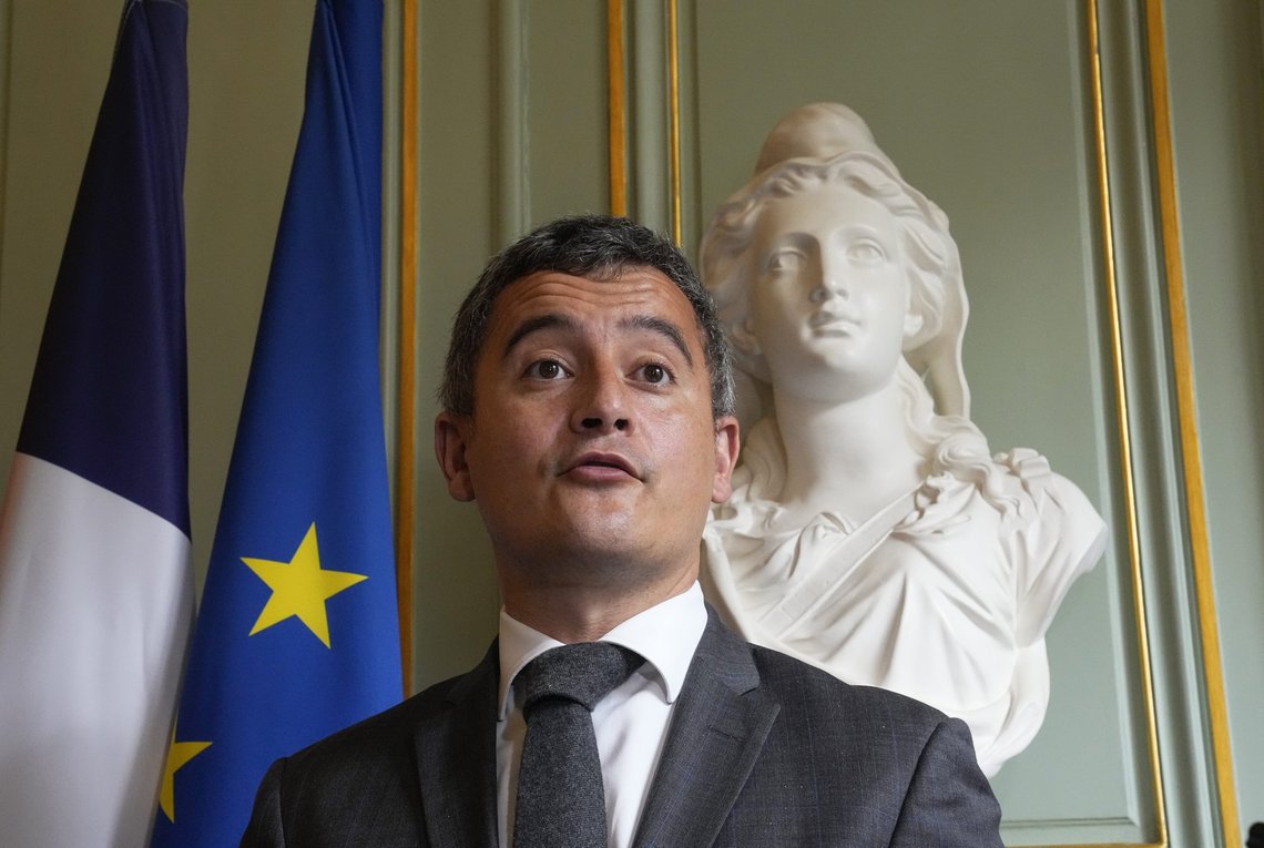 FILE - In this Tuesday, May 25, 2021 file photo, French Interior Minister Gerald Darmanin gestures during a media conference at the Interior Ministry in Paris. Several hundred police on Friday, June 4 cleared out a makeshift migrant camp in the northern French port city of Calais, a magnet for people trying to get into Britain illegally across the English Channel. The sweep came on instructions from Interior Minister Gerald Darmanin and a court order. (AP Photo/Michel Euler, file) FILE - In this Tuesday, May 25, 2021 file photo, French Interior Minister Gerald Darmanin gestures during a media conference at the Interior Ministry in Paris. Several hundred police on Friday, June 4 cleared out a makeshift migrant camp in the northern French port city of Calais, a magnet for people trying to get into Britain illegally across the English Channel. The sweep came on instructions from Interior Minister Gerald Darmanin and a court order. (AP Photo/Michel Euler, file)