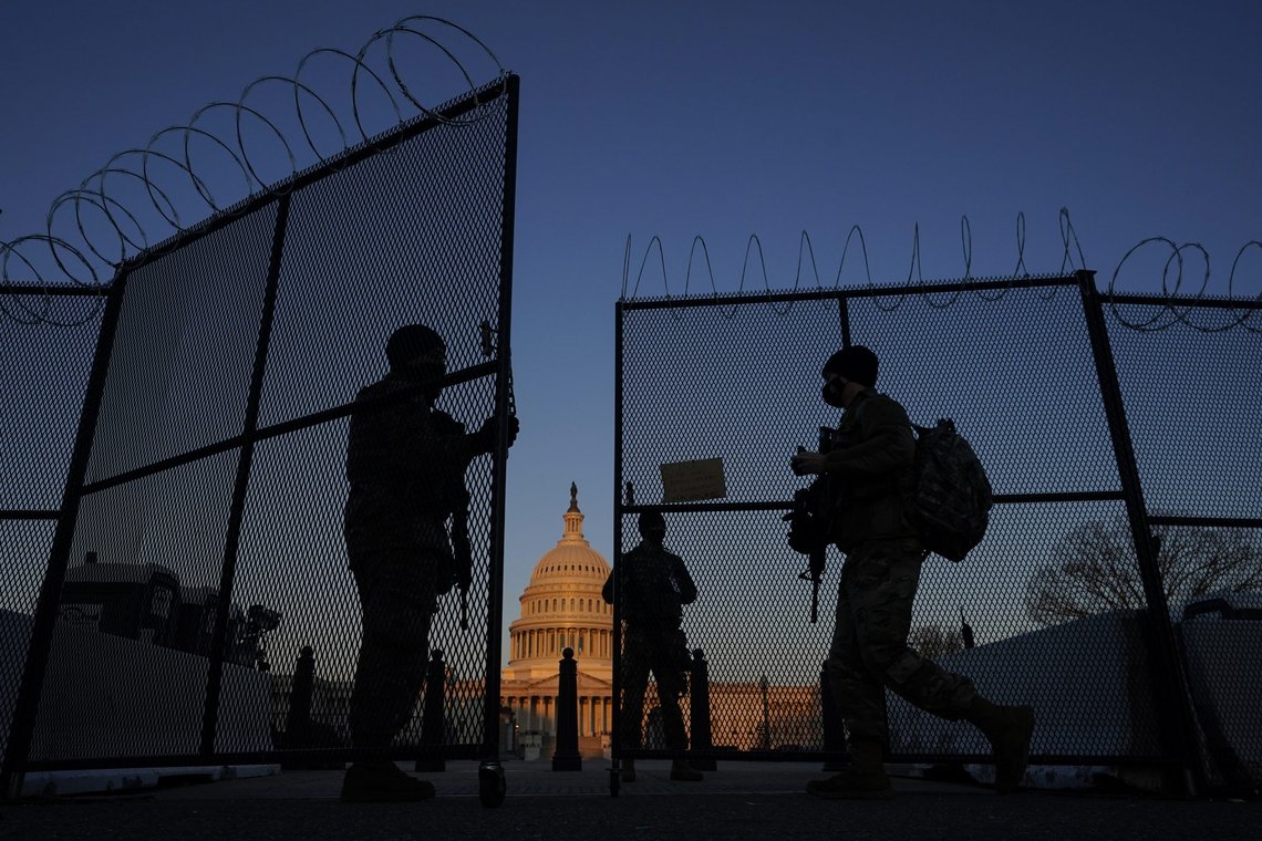 FILE - In this March 8, 2021, file photo, members of the National Guard open a gate in the razor wire topped perimeter fence around the Capitol at sunrise in Washington. Threats to members of Congress have more than doubled this year, according to the U.S. Capitol Police, and many members say they fear for their personal safety more than they did before the siege. (AP Photo/Carolyn Kaster, File) FILE - In this March 8, 2021, file photo, members of the National Guard open a gate in the razor wire topped perimeter fence around the Capitol at sunrise in Washington. Threats to members of Congress have more than doubled this year, according to the U.S. Capitol Police, and many members say they fear for their personal safety more than they did before the siege. (AP Photo/Carolyn Kaster, File)
