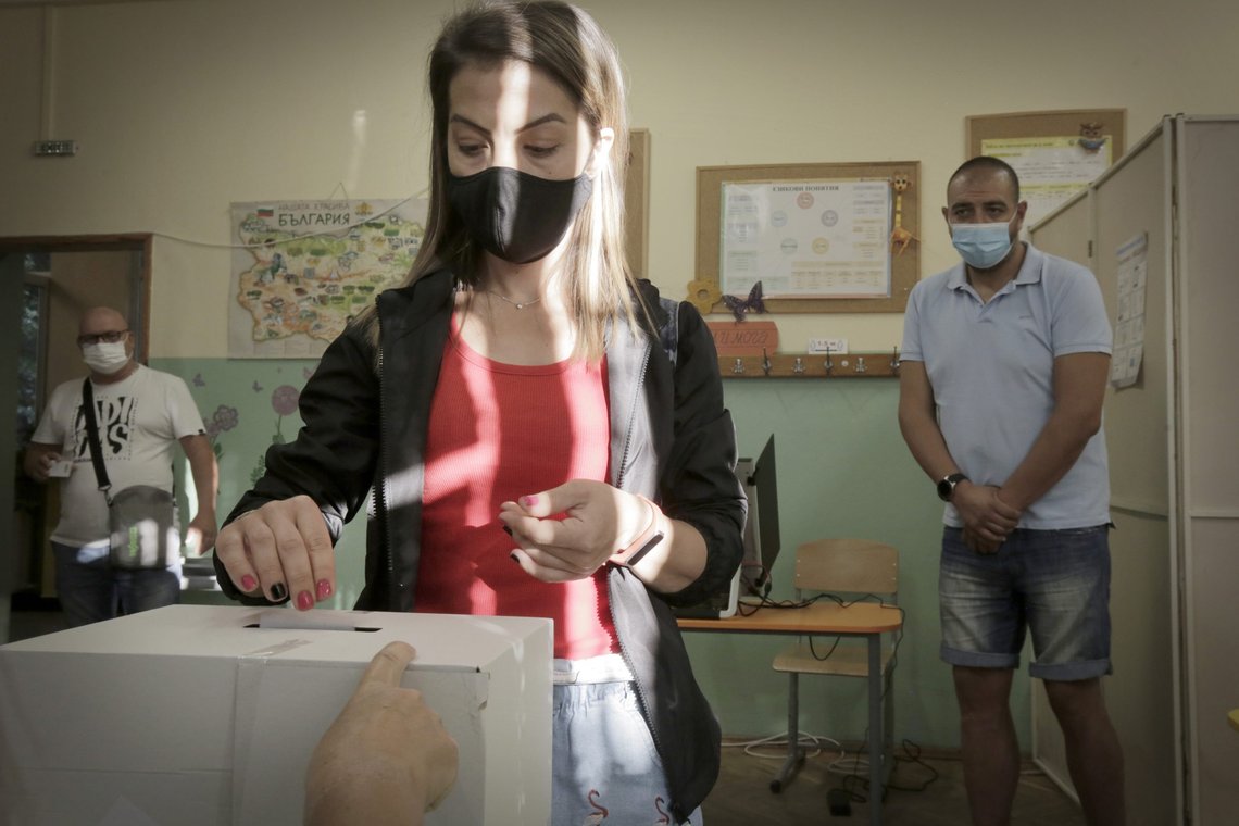A woman casts her vote in Sofia, Sunday, July 11, 2021. Bulgarians are voting in a snap poll on Sunday after a previous election in April produced a fragmented parliament that failed to form a viable coalition government. (AP Photo/Valentina Petrova) A woman casts her vote in Sofia, Sunday, July 11, 2021. Bulgarians are voting in a snap poll on Sunday after a previous election in April produced a fragmented parliament that failed to form a viable coalition government. (AP Photo/Valentina Petrova)