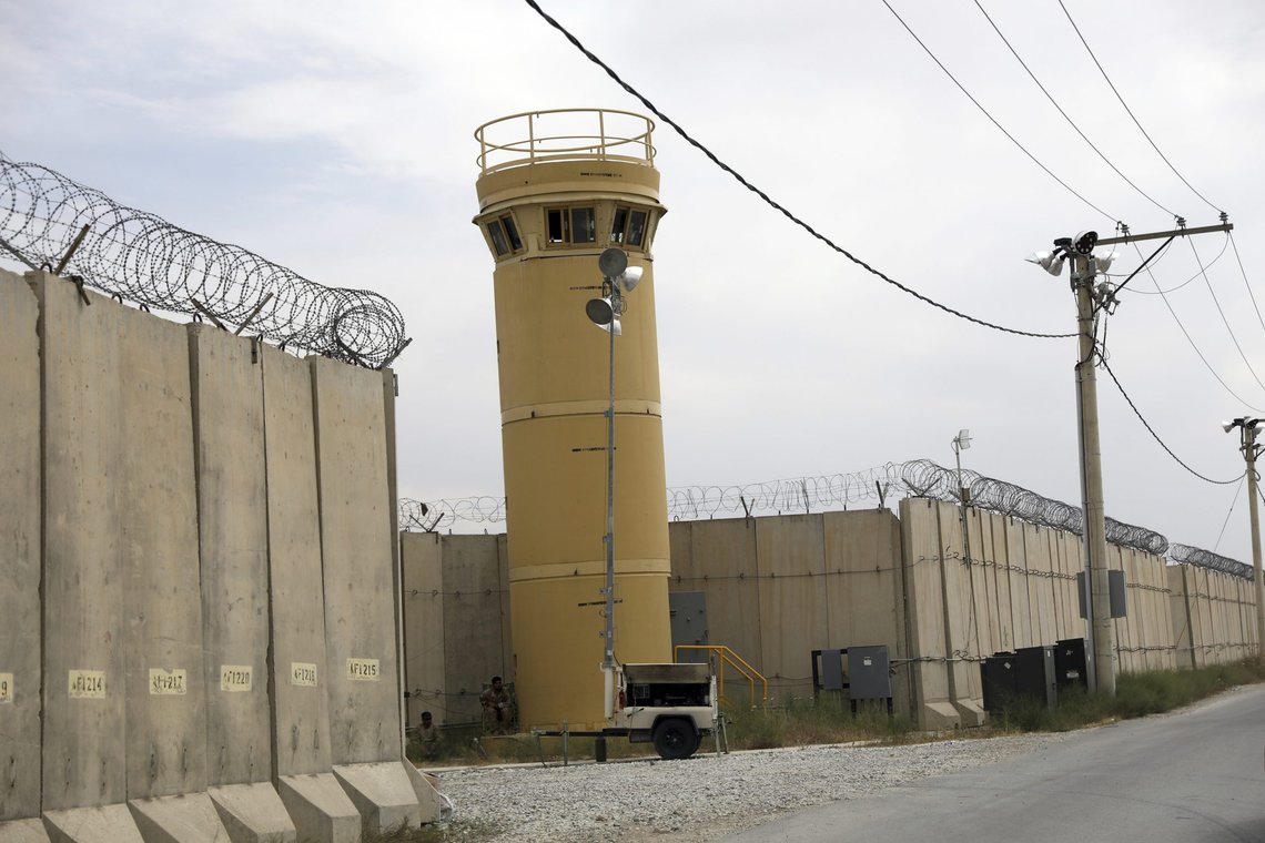 Afghan security forces member keep watch after the American military left Bagram air base, in Parwan province north of Kabul, Afghanistan, Monday, July 5, 2021. The U.S. left Afghanistan's Bagram Airfield after nearly 20 years, winding up its "forever war," in the night, without notifying the new Afghan commander until more than two hours after they slipped away. (AP Photo/Rahmat Gul) Afghan security forces member keep watch after the American military left Bagram air base, in Parwan province north of Kabul, Afghanistan, Monday, July 5, 2021. The U.S. left Afghanistan's Bagram Airfield after nearly 20 years, winding up its "forever war," in the night, without notifying the new Afghan commander until more than two hours after they slipped away. (AP Photo/Rahmat Gul)