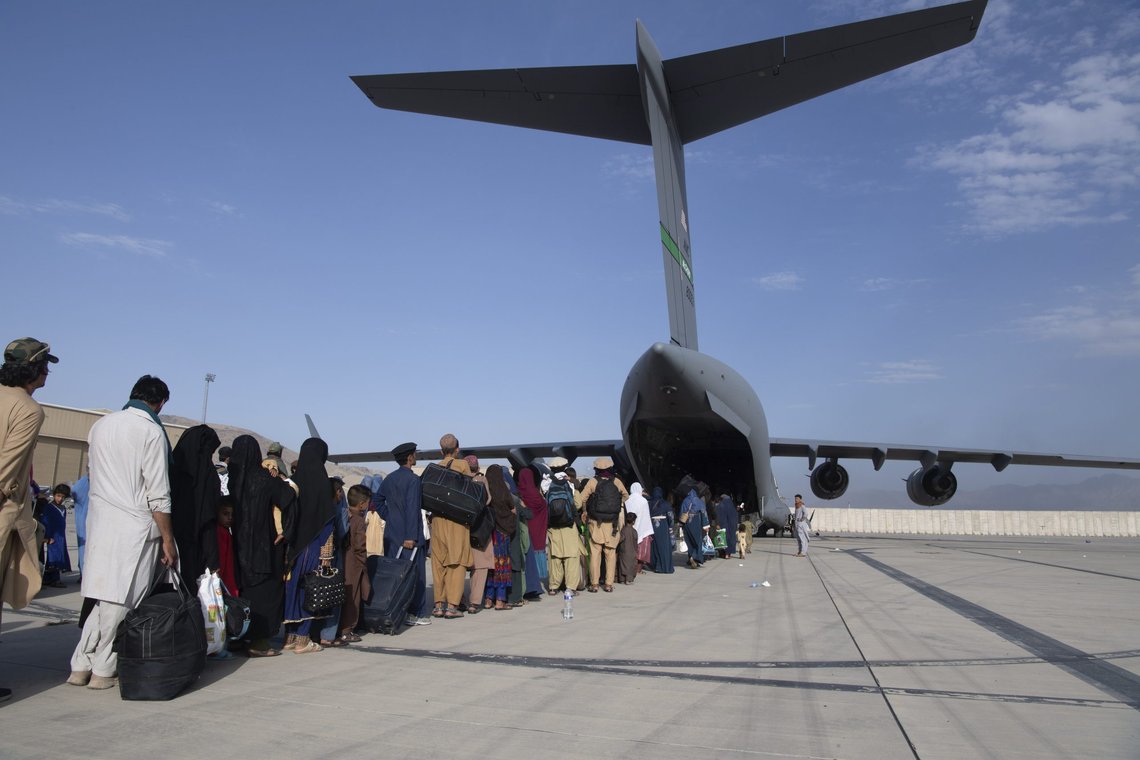 In this image provided by the U.S. Air Force, U.S. Air Force loadmasters and pilots assigned to the 816th Expeditionary Airlift Squadron, load people being evacuated from Afghanistan onto a U.S. Air Force C-17 Globemaster III at Hamid Karzai International Airport in Kabul, Afghanistan, Tuesday, Aug. 24, 2021. (Master Sgt. Donald R. Allen/U.S. Air Force via AP) In this image provided by the U.S. Air Force, U.S. Air Force loadmasters and pilots assigned to the 816th Expeditionary Airlift Squadron, load people being evacuated from Afghanistan onto a U.S. Air Force C-17 Globemaster III at Hamid Karzai International Airport in Kabul, Afghanistan, Tuesday, Aug. 24, 2021. (Master Sgt. Donald R. Allen/U.S. Air Force via AP)