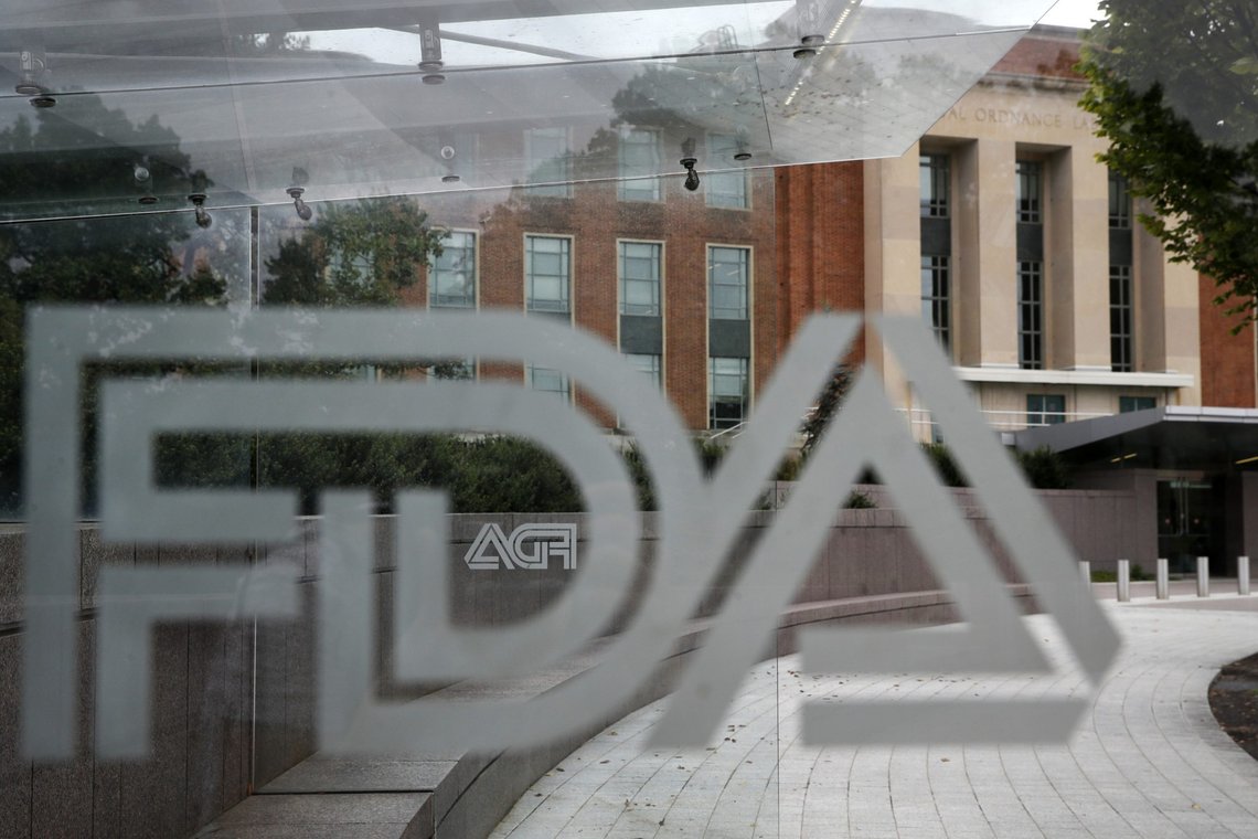 FILE - This Aug. 2, 2018, file photo shows the U.S. Food and Drug Administration building behind FDA logos at a bus stop on the agency's campus in Silver Spring, Md. The FDA has approved the first generic copies of a popular, pricey pill for nerve pain. The agency on Monday, July 22, 2019, said it approved nine generic versions of Pfizer Inc.?Äôs Lyrica. (AP Photo/Jacquelyn Martin, File) FILE - This Aug. 2, 2018, file photo shows the U.S. Food and Drug Administration building behind FDA logos at a bus stop on the agency's campus in Silver Spring, Md. The FDA has approved the first generic copies of a popular, pricey pill for nerve pain. The agency on Monday, July 22, 2019, said it approved nine generic versions of Pfizer Inc.?Äôs Lyrica. (AP Photo/Jacquelyn Martin, File)