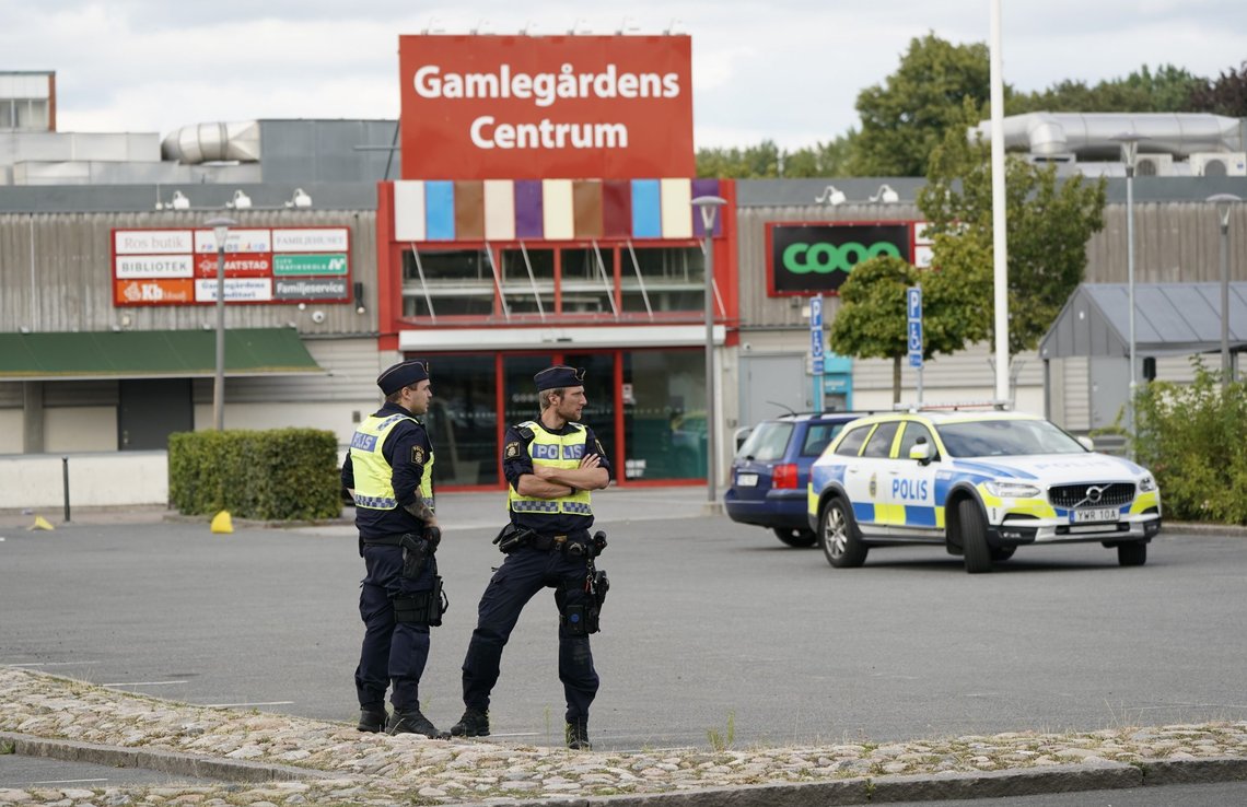 Police stand at the scene of a shooting incident, in the Nasby area, of Kristianstad, Sweden, Tuesday, Aug. 3, 2021. Police say that at least two people have been injured in a shooting in the southern Swedish city of Kristianstad. Swedish police received an alert on Tuesday afternoon that several loud bangs had been heard. According to preliminary information, no one was killed. (Johan Nilsson/TT News Agency via AP) Police stand at the scene of a shooting incident, in the Nasby area, of Kristianstad, Sweden, Tuesday, Aug. 3, 2021. Police say that at least two people have been injured in a shooting in the southern Swedish city of Kristianstad. Swedish police received an alert on Tuesday afternoon that several loud bangs had been heard. According to preliminary information, no one was killed. (Johan Nilsson/TT News Agency via AP)