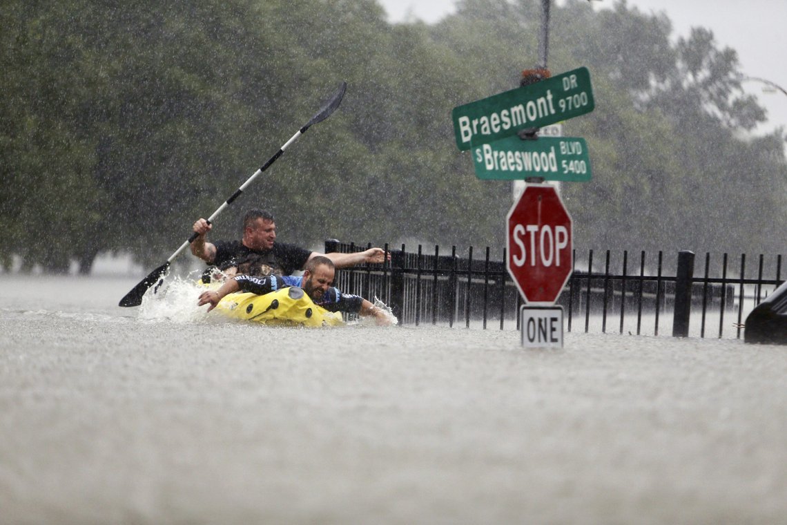 FILE - In this Sunday, Aug. 27, 2017. file photo, two kayakers try to beat the current pushing them down an overflowing Brays Bayou from Tropical Storm Harvey in Houston, Texas. The Intergovernmental Panel on Climate Change report released on Monday, Aug. 9, 2021, says warming already is smacking Earth hard and quickly with accelerating sea level rise, shrinking ice and worsening extremes such as heat waves, droughts, floods and storms. (Mark Mulligan/Houston Chronicle via AP, FIle) FILE - In this Sunday, Aug. 27, 2017. file photo, two kayakers try to beat the current pushing them down an overflowing Brays Bayou from Tropical Storm Harvey in Houston, Texas. The Intergovernmental Panel on Climate Change report released on Monday, Aug. 9, 2021, says warming already is smacking Earth hard and quickly with accelerating sea level rise, shrinking ice and worsening extremes such as heat waves, droughts, floods and storms. (Mark Mulligan/Houston Chronicle via AP, FIle)