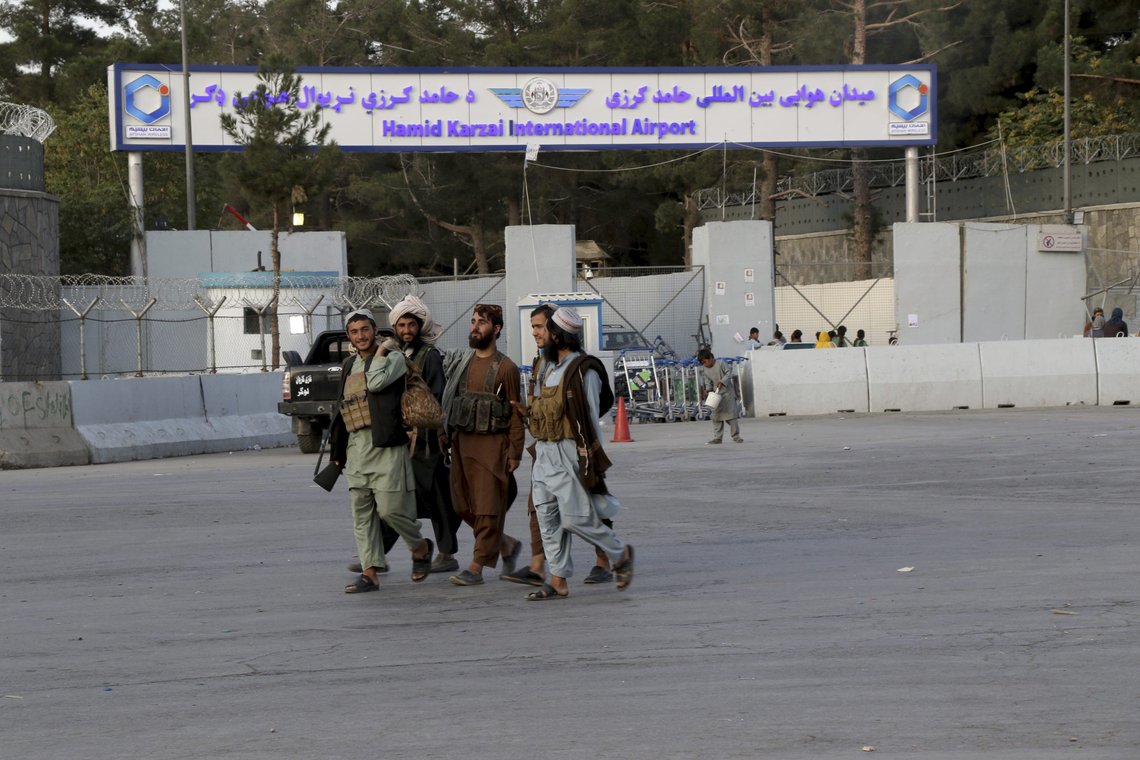 Taliban fighters walk in front of the gate of Hamid Karzai international Airport in Kabul, Afghanistan, Saturday, Aug. 28, 2021. The Taliban have sealed off Kabuls airport to most would-be evacuees to prevent large crowds from gathering after this week's deadly suicide attack. The massive U.S.-led airlift was winding down Saturday ahead of a U.S. deadline to withdraw from Afghanistan by Tuesday. (AP Photo/Wali Sabawoon) Taliban fighters walk in front of the gate of Hamid Karzai international Airport in Kabul, Afghanistan, Saturday, Aug. 28, 2021. The Taliban have sealed off Kabuls airport to most would-be evacuees to prevent large crowds from gathering after this week's deadly suicide attack. The massive U.S.-led airlift was winding down Saturday ahead of a U.S. deadline to withdraw from Afghanistan by Tuesday. (AP Photo/Wali Sabawoon)