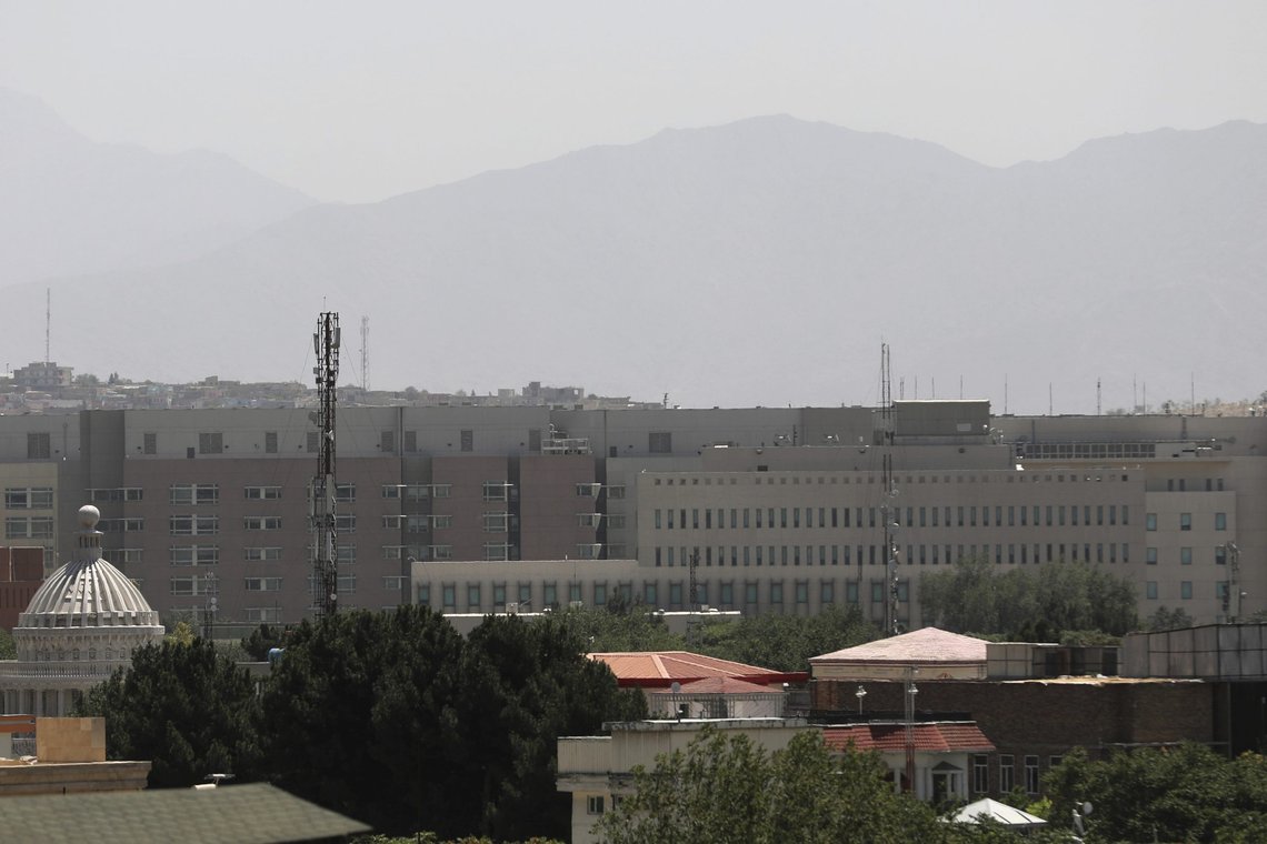 The U.S. Embassy buildings, center, are seen in Kabul, Afghanistan, Saturday, Aug. 14, 2021. The last-minute decision to send 3,000 U.S. troops to Afghanistan to help partially evacuate the U.S. Embassy is calling into question whether President Joe Biden will meet his Aug. 31, deadline for fully withdrawing combat forces. The vanguard of a Marine contingent arrived in Kabul on Friday and most of the rest of the 3,000 are due by Sunday. (AP Photo/Rahmat Gul) The U.S. Embassy buildings, center, are seen in Kabul, Afghanistan, Saturday, Aug. 14, 2021. The last-minute decision to send 3,000 U.S. troops to Afghanistan to help partially evacuate the U.S. Embassy is calling into question whether President Joe Biden will meet his Aug. 31, deadline for fully withdrawing combat forces. The vanguard of a Marine contingent arrived in Kabul on Friday and most of the rest of the 3,000 are due by Sunday. (AP Photo/Rahmat Gul)