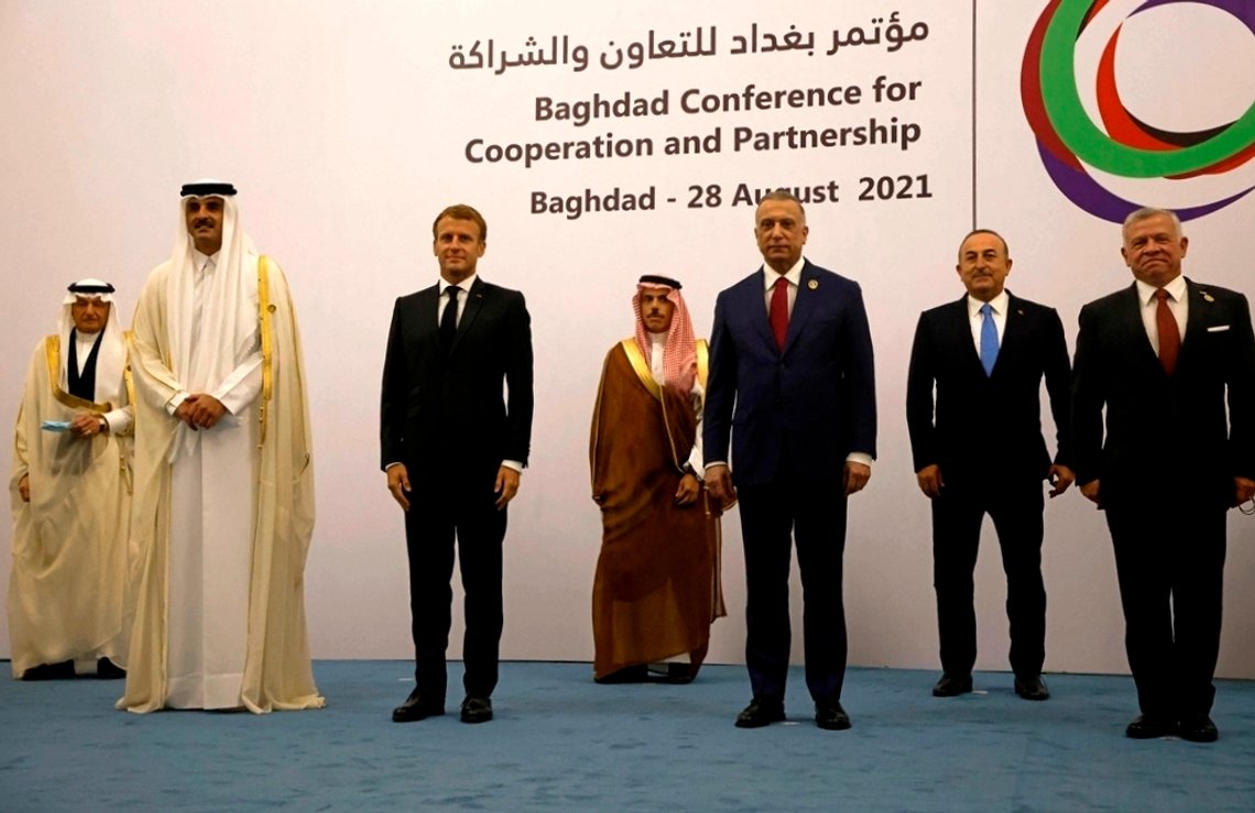 From left, Qatar's Emir Sheikh Tamim al-Thani, French President Emmanuel Macron, Saudi Foreign Minister Faisal bin Farhan, Iraq's Prime Minister Mustafa al-Kadhemi, Turkey's Foreign Minister Mevlut Cavusoglu, Jordan's King Abdullah II, and Arab League Secretary-General Ahmed Aboul-Gheit pose for a picture during the Baghdad Conference for Cooperation and Partnership in Baghdad, Saturday, Aug. 28, 2021. (Iraqi Prime Minister Media Office, via AP) From left, Qatar's Emir Sheikh Tamim al-Thani, French President Emmanuel Macron, Saudi Foreign Minister Faisal bin Farhan, Iraq's Prime Minister Mustafa al-Kadhemi, Turkey's Foreign Minister Mevlut Cavusoglu, Jordan's King Abdullah II, and Arab League Secretary-General Ahmed Aboul-Gheit pose for a picture during the Baghdad Conference for Cooperation and Partnership in Baghdad, Saturday, Aug. 28, 2021. (Iraqi Prime Minister Media Office, via AP)