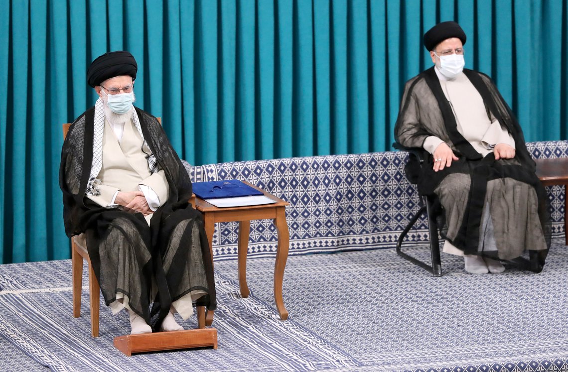 In this photo released by an official website of the office of the Iranian supreme leader, Supreme Leader Ayatollah Ali Khamenei, left, sits in an endorsement ceremony to give his official seal of approval to newly elected President Ebrahim Raisi, right, in Tehran, Iran, Tuesday, Aug. 3, 2021. (Office of the Iranian Supreme Leader via AP) In this photo released by an official website of the office of the Iranian supreme leader, Supreme Leader Ayatollah Ali Khamenei, left, sits in an endorsement ceremony to give his official seal of approval to newly elected President Ebrahim Raisi, right, in Tehran, Iran, Tuesday, Aug. 3, 2021. (Office of the Iranian Supreme Leader via AP)
