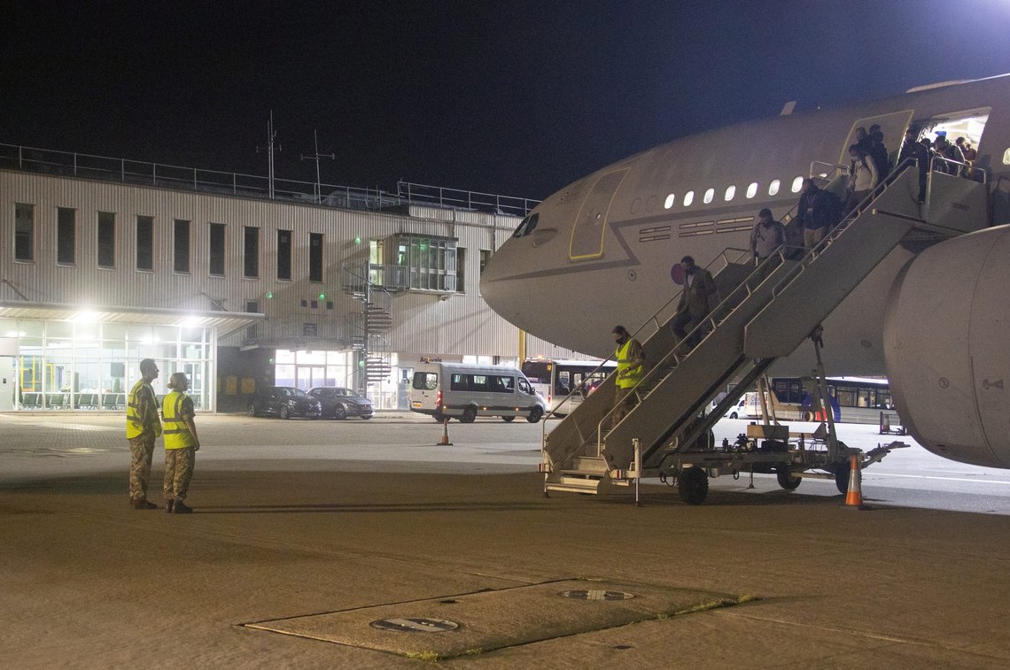 FILE - In the file photo dated Monday Aug. 16, 2021, provided by the Ministry of Defence, the first flight carrying evacuated personnel of British Embassy staff and various British Nationals, arriving from Kabul at RAF Brize Norton in England, early. Taliban forces have toppled the Western-backed Afghanistan government, as international nations scramble to evacuate diplomats and vulnerable people from Kabul. Britains defence chief Ben Wallace on Friday Aug. 27, 2021, is promising to investigate a security lapse that saw documents identifying Afghan staff and job applicants left behind at the abandoned U.K. embassy in Kabul. (Sharron Flyod/Ministry of Defence via AP, FILE) FILE - In the file photo dated Monday Aug. 16, 2021, provided by the Ministry of Defence, the first flight carrying evacuated personnel of British Embassy staff and various British Nationals, arriving from Kabul at RAF Brize Norton in England, early. Taliban forces have toppled the Western-backed Afghanistan government, as international nations scramble to evacuate diplomats and vulnerable people from Kabul. Britains defence chief Ben Wallace on Friday Aug. 27, 2021, is promising to investigate a security lapse that saw documents identifying Afghan staff and job applicants left behind at the abandoned U.K. embassy in Kabul. (Sharron Flyod/Ministry of Defence via AP, FILE)