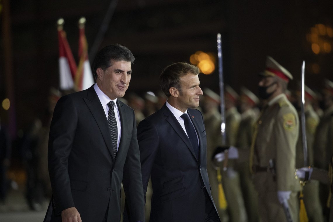 Kurdish President Nechirvan Barzani, left, welcomes French President Emmanuel Macron upon his arrival to Irbil airport, Iraq, early Sunday, Aug. 29, 2021. (AP Photo/Hadi Mizban) Kurdish President Nechirvan Barzani, left, welcomes French President Emmanuel Macron upon his arrival to Irbil airport, Iraq, early Sunday, Aug. 29, 2021. (AP Photo/Hadi Mizban)