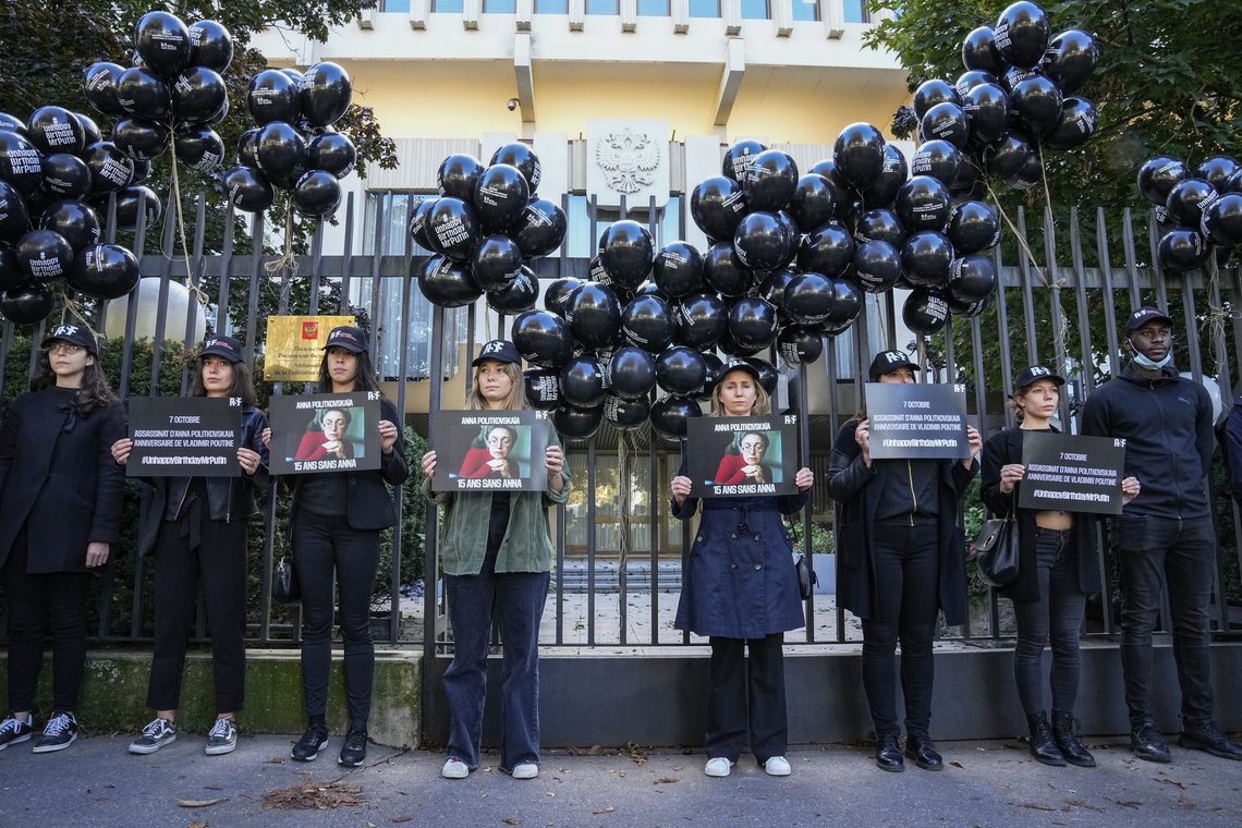 Members of Reporters Without Borders, stage a demonstration outside the Russian embassy in Paris, Wednesday, Oct. 6, 2021, to pay tribute to late Russian journalist Anna Politkovskaya who was shot dead on Oct. 7, 2006 in Moscow. Anna Politkovskaya was a prominent journalist at the Novaya Gazeta newspaper who was famous for her critical coverage of the war in Chechnya . The day of her death coincidence with the birthday of Russian President Vladimir Putin. (AP Photo/Michel Euler) Members of Reporters Without Borders, stage a demonstration outside the Russian embassy in Paris, Wednesday, Oct. 6, 2021, to pay tribute to late Russian journalist Anna Politkovskaya who was shot dead on Oct. 7, 2006 in Moscow. Anna Politkovskaya was a prominent journalist at the Novaya Gazeta newspaper who was famous for her critical coverage of the war in Chechnya . The day of her death coincidence with the birthday of Russian President Vladimir Putin. (AP Photo/Michel Euler)