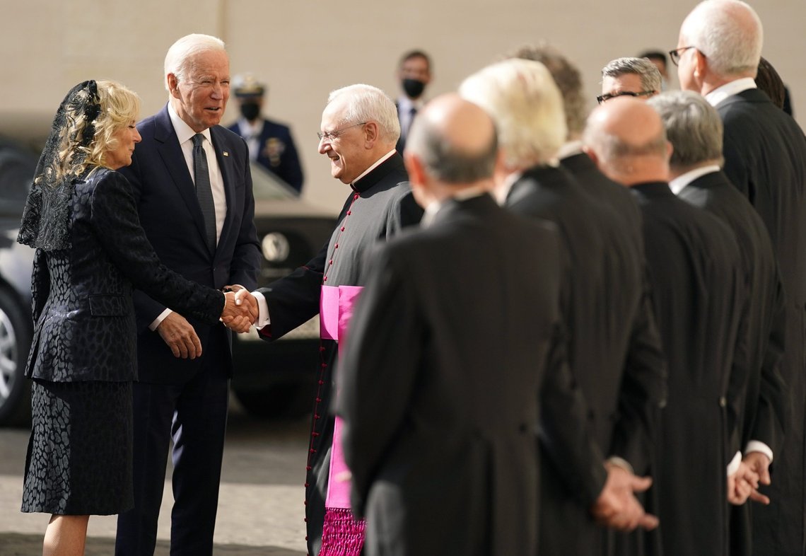 U.S. President Joe Biden and first lady Jill Biden are greeted by the Head of the Papal Household, Mons. Leonardo Sapienza, center, as they arrive for a meeting with Pope Francis at the Vatican, Friday, Oct. 29, 2021. A Group of 20 summit scheduled for this weekend in Rome is the first in-person gathering of leaders of the world's biggest economies since the COVID-19 pandemic started. (AP Photo/Evan Vucci) U.S. President Joe Biden and first lady Jill Biden are greeted by the Head of the Papal Household, Mons. Leonardo Sapienza, center, as they arrive for a meeting with Pope Francis at the Vatican, Friday, Oct. 29, 2021. A Group of 20 summit scheduled for this weekend in Rome is the first in-person gathering of leaders of the world's biggest economies since the COVID-19 pandemic started. (AP Photo/Evan Vucci)