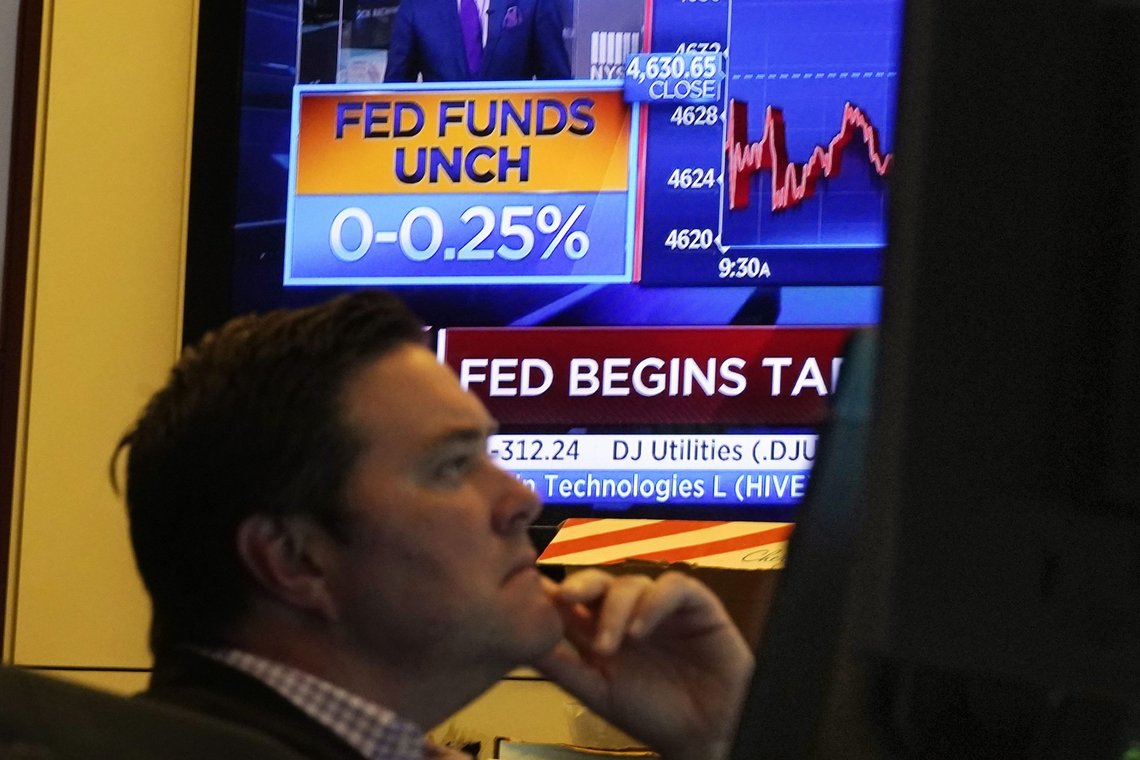 A television screen on the floor of the New York Stock Exchange shows the rate decision of the Federal Reserve, Wednesday, Nov. 3, 2021. The Federal Reserve will begin dialing back the extraordinary economic aid it's provided since the pandemic erupted last year, a response to high inflation that now looks likely to persist longer than it did just a few months ago. (AP Photo/Richard Drew) A television screen on the floor of the New York Stock Exchange shows the rate decision of the Federal Reserve, Wednesday, Nov. 3, 2021. The Federal Reserve will begin dialing back the extraordinary economic aid it's provided since the pandemic erupted last year, a response to high inflation that now looks likely to persist longer than it did just a few months ago. (AP Photo/Richard Drew)