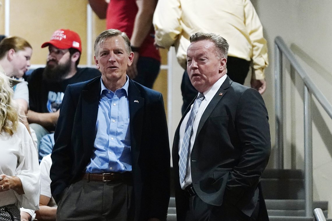 Rep. Paul Gosar, R-Ariz., left, talks with former Arizona state Rep. Anthony Kern, R-Glendale, prior to the Arizona Senate Republicans hearing review of the 2020 presidential election results in Maricopa County at the Arizona Capitol, Friday, Sept. 24, 2021, in Phoenix. The final report was announced that President Joe Biden did indeed win the 2020 presidential contest. (AP Photo/Ross D. Franklin) Rep. Paul Gosar, R-Ariz., left, talks with former Arizona state Rep. Anthony Kern, R-Glendale, prior to the Arizona Senate Republicans hearing review of the 2020 presidential election results in Maricopa County at the Arizona Capitol, Friday, Sept. 24, 2021, in Phoenix. The final report was announced that President Joe Biden did indeed win the 2020 presidential contest. (AP Photo/Ross D. Franklin)