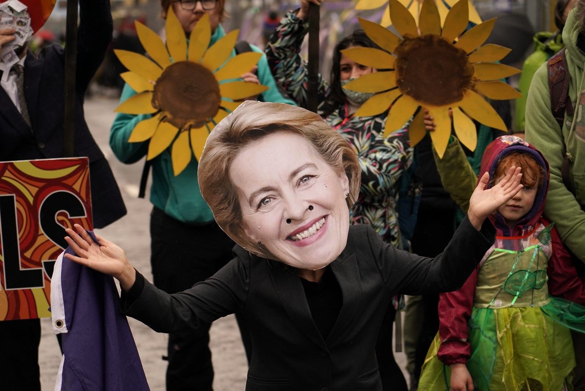 A climate activist wearing a mask of European Commission President Ursula von der Leyen takes part in a demonstration against the use of fossil fuels outside the venue for the COP26 U.N. Climate Summit in Glasgow, Scotland, Friday, Nov. 12, 2021. Negotiators from almost 200 nations were making a fresh push Friday to reach agreements on a series of key issues that would allow them to call this year's U.N. climate talks a success. (AP Photo/Alberto Pezzali) A climate activist wearing a mask of European Commission President Ursula von der Leyen takes part in a demonstration against the use of fossil fuels outside the venue for the COP26 U.N. Climate Summit in Glasgow, Scotland, Friday, Nov. 12, 2021. Negotiators from almost 200 nations were making a fresh push Friday to reach agreements on a series of key issues that would allow them to call this year's U.N. climate talks a success. (AP Photo/Alberto Pezzali)
