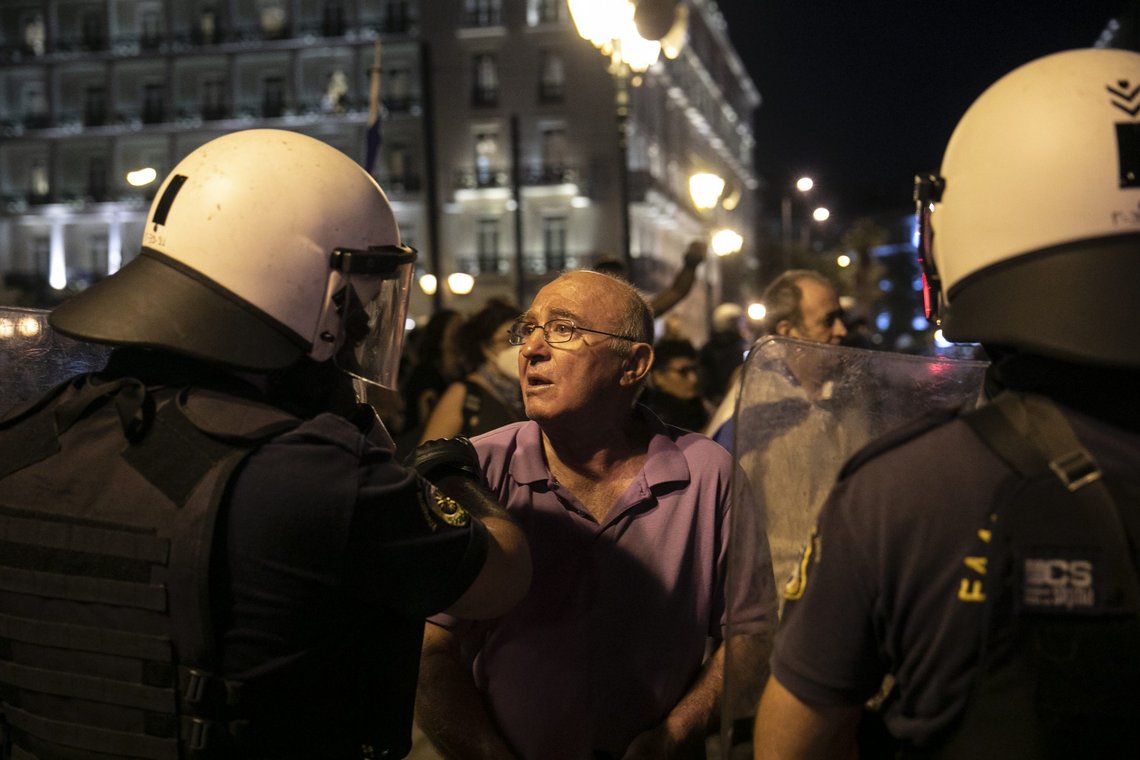 An anti-vaccine protester is forced to get on a police bus following clashes around central Syntagma square, in Athens, Greece, Sunday, Aug. 29, 2021. Police used tear gas to disperse thousands of protesters opposing government's plans for mandatory vaccination and new testing requirements and attendance restrictions on people who aren't vaccinated against COVID-19. (AP Photo/Yorgos Karahalis) An anti-vaccine protester is forced to get on a police bus following clashes around central Syntagma square, in Athens, Greece, Sunday, Aug. 29, 2021. Police used tear gas to disperse thousands of protesters opposing government's plans for mandatory vaccination and new testing requirements and attendance restrictions on people who aren't vaccinated against COVID-19. (AP Photo/Yorgos Karahalis)