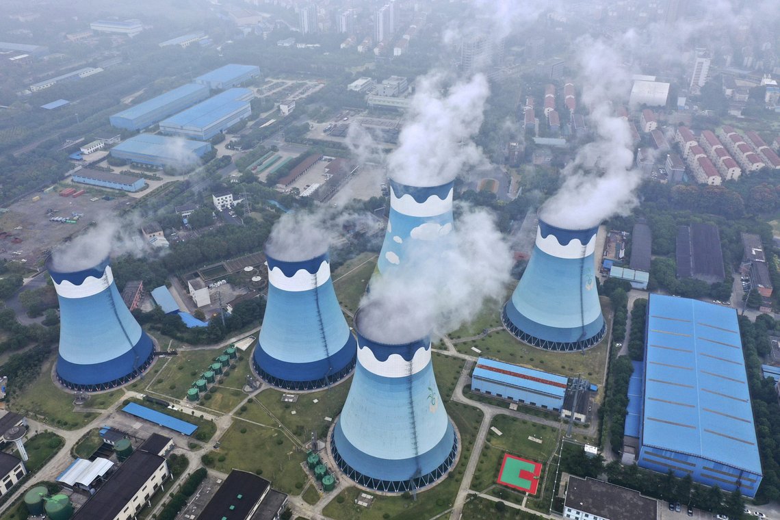 FILE - In this Sept. 27, 2021 file photo, steam billows out of the cooling towers at a coal-fired power station in Nanjing in east China's Jiangsu province. The world's facing an energy crunch. Europe is feeling it worst as natural gas prices skyrocket to five times normal, forcing some factories to hold back production. Reserves depleted last winter haven't been made up, and chief supplier Russia has held back on supplying extra. Meanwhile, the new Nord Stream 2 gas pipeline won't start operating in time to help if the weather is cold, and there's talk Europe could wind up rationing electricity. China is feeling it too, seeing power outages in some towns. (Chinatopix via AP, file) FILE - In this Sept. 27, 2021 file photo, steam billows out of the cooling towers at a coal-fired power station in Nanjing in east China's Jiangsu province. The world's facing an energy crunch. Europe is feeling it worst as natural gas prices skyrocket to five times normal, forcing some factories to hold back production. Reserves depleted last winter haven't been made up, and chief supplier Russia has held back on supplying extra. Meanwhile, the new Nord Stream 2 gas pipeline won't start operating in time to help if the weather is cold, and there's talk Europe could wind up rationing electricity. China is feeling it too, seeing power outages in some towns. (Chinatopix via AP, file)