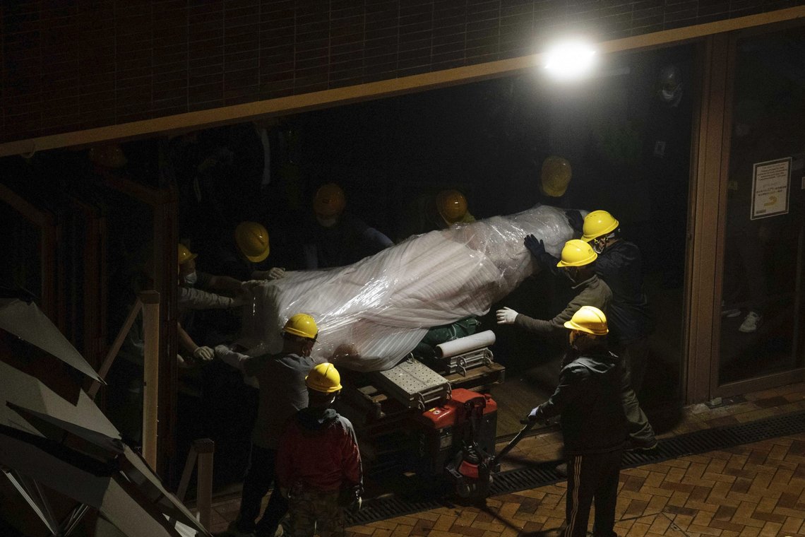 The "Pillar of Shame" statue, a memorial for those killed in the 1989 Tiananmen crackdown, is removed from the University of Hong Kong, Thursday, Dec. 23, 2021. The monument at the university that commemorated the 1989 Tiananmen massacre was boarded up by workers late Wednesday, prompting fears over the future of the monument as the city's authorities crack down on dissent. (Lam Chun Tung/The Initium Media via AP) The "Pillar of Shame" statue, a memorial for those killed in the 1989 Tiananmen crackdown, is removed from the University of Hong Kong, Thursday, Dec. 23, 2021. The monument at the university that commemorated the 1989 Tiananmen massacre was boarded up by workers late Wednesday, prompting fears over the future of the monument as the city's authorities crack down on dissent. (Lam Chun Tung/The Initium Media via AP)