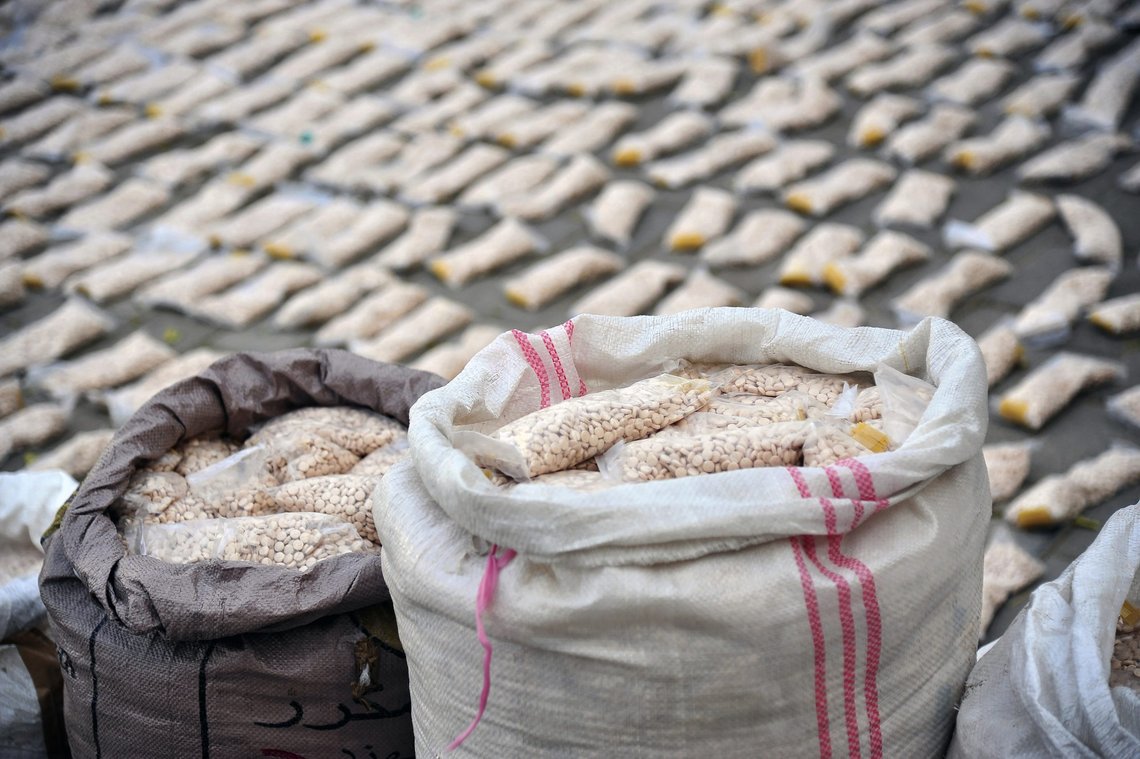 In this photo released by the Syrian official news agency SANA, Syrian authorities display Captagon pills, in rural Damascus, Syria, Tuesday, Nov. 30, 2021. Syrian authorities said on Tuesday they have seized over 500 kilograms (over 1,000 pounds) of amphetamine pills known as Captagon smuggled in pasta and headed for Saudi Arabia. (SANA via AP) In this photo released by the Syrian official news agency SANA, Syrian authorities display Captagon pills, in rural Damascus, Syria, Tuesday, Nov. 30, 2021. Syrian authorities said on Tuesday they have seized over 500 kilograms (over 1,000 pounds) of amphetamine pills known as Captagon smuggled in pasta and headed for Saudi Arabia. (SANA via AP)