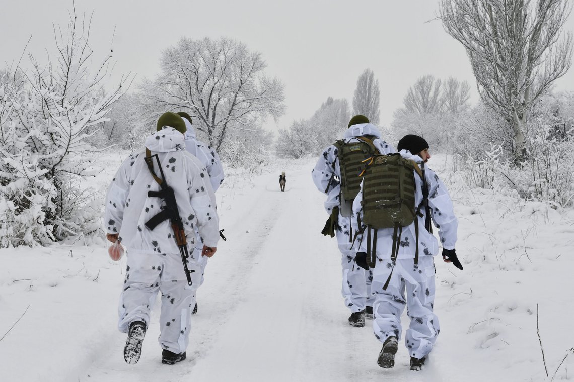 Ukrainian servicemen walk to their position at the frontline with with Russia-backed separatists outside Verkhnotoretske village in Yasynuvata district of Donetsk region, eastern Ukraine, Monday, Dec. 27, 2021. A statement from Zelenskyy's office described "the importance of getting the United States involved in the process of a peaceful settlement" to the conflict in eastern Ukraine, where Russia-backed rebels have been fighting Ukrainian forces since 2014. (AP Photo/Andriy Andriyenko) Ukrainian servicemen walk to their position at the frontline with with Russia-backed separatists outside Verkhnotoretske village in Yasynuvata district of Donetsk region, eastern Ukraine, Monday, Dec. 27, 2021. A statement from Zelenskyy's office described "the importance of getting the United States involved in the process of a peaceful settlement" to the conflict in eastern Ukraine, where Russia-backed rebels have been fighting Ukrainian forces since 2014. (AP Photo/Andriy Andriyenko)