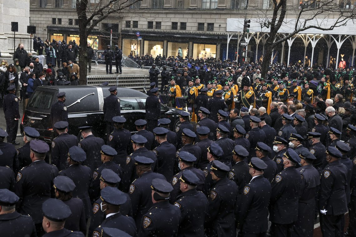 A hearse carrying the casket of NYPD officer Jason Rivera prepares to pull away after Rivera's funeral service at St. Patrick's Cathedral, Friday, Jan. 28, 2022, in New York. Rivera and his partner, Officer Wilbert Mora, were fatally wounded when a gunman ambushed them in an apartment as they responded to a family dispute last week. (AP Photo/Yuki Iwamura) A hearse carrying the casket of NYPD officer Jason Rivera prepares to pull away after Rivera's funeral service at St. Patrick's Cathedral, Friday, Jan. 28, 2022, in New York. Rivera and his partner, Officer Wilbert Mora, were fatally wounded when a gunman ambushed them in an apartment as they responded to a family dispute last week. (AP Photo/Yuki Iwamura)