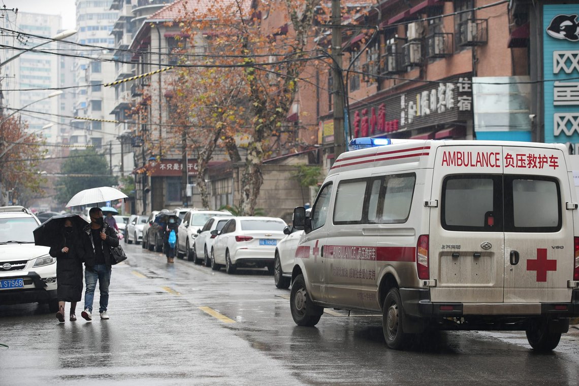 An ambulance passes by residents wearing face masks to help protect against COVID-19 near a hospital in Wuhan in central China's Hubei Province, Sunday, Jan. 23, 2022. Sunday will mark two years since the city of Wuhan was placed under a 76-day lockdown as China tried to contain the first major outbreak of the coronavirus pandemic. (AP Photo) An ambulance passes by residents wearing face masks to help protect against COVID-19 near a hospital in Wuhan in central China's Hubei Province, Sunday, Jan. 23, 2022. Sunday will mark two years since the city of Wuhan was placed under a 76-day lockdown as China tried to contain the first major outbreak of the coronavirus pandemic. (AP Photo)