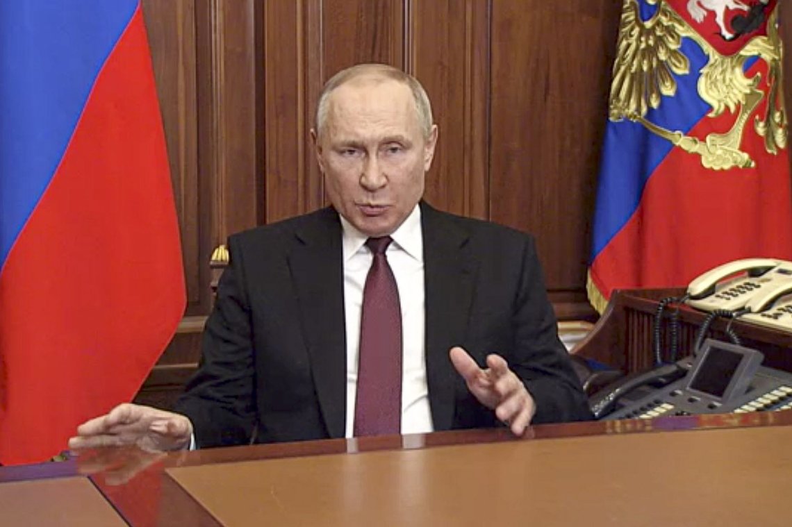 In this image made from video released by the Russian Presidential Press Service, Russian President Vladimir Putin addressees the nation in Moscow, Russia, Thursday, Feb. 24, 2022. Russian troops launched their anticipated attack on Ukraine on Thursday, as Putin cast aside international condemnation and sanctions and warned other countries that any attempt to interfere would lead to "consequences you have never seen." (Russian Presidential Press Service via AP) In this image made from video released by the Russian Presidential Press Service, Russian President Vladimir Putin addressees the nation in Moscow, Russia, Thursday, Feb. 24, 2022. Russian troops launched their anticipated attack on Ukraine on Thursday, as Putin cast aside international condemnation and sanctions and warned other countries that any attempt to interfere would lead to "consequences you have never seen." (Russian Presidential Press Service via AP)