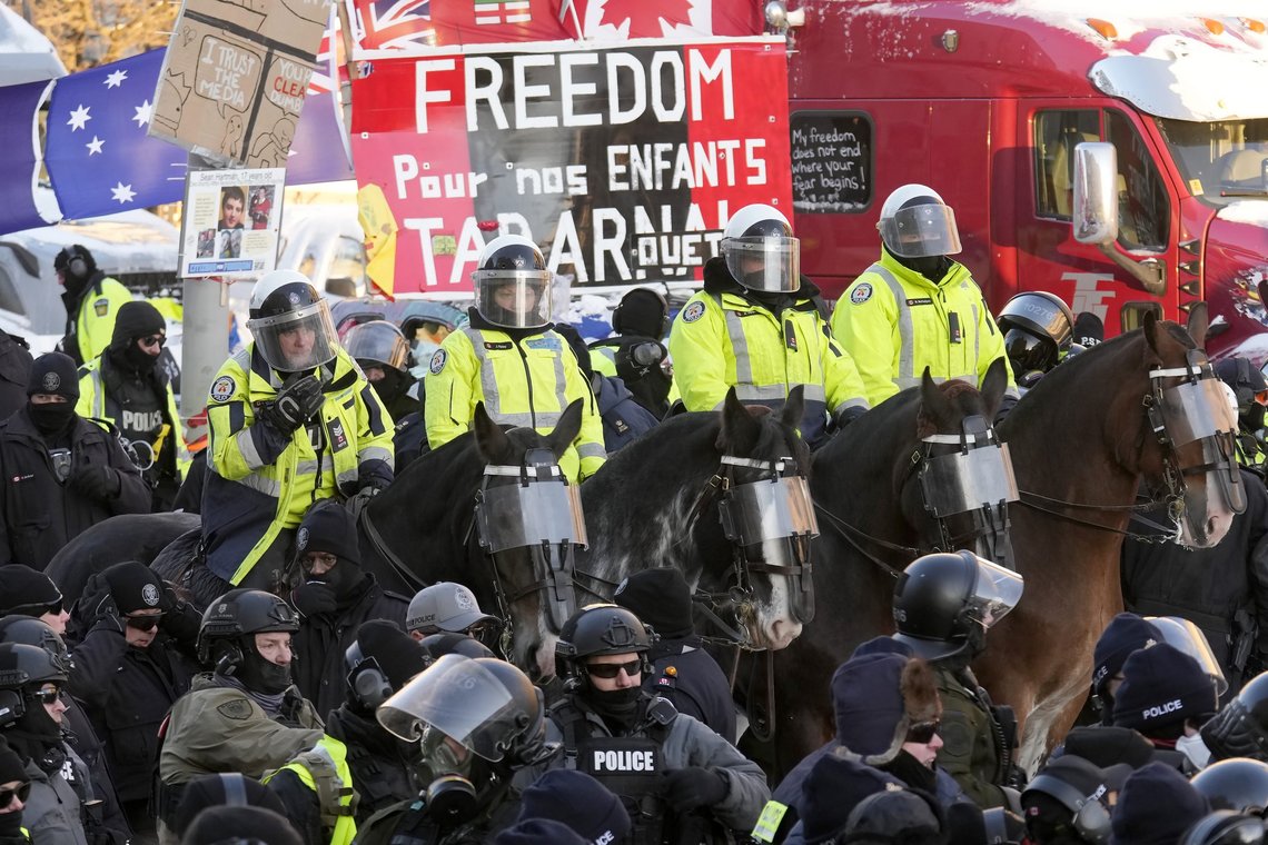 Toronto Police mounted unit officers stand by as police take action to put an end to a protest, which started in opposition to mandatory COVID-19 vaccine mandates and grew into a broader anti-government demonstration and occupation, Friday, Feb. 18, 2022, in Ottawa. (Adrian Wyld /The Canadian Press via AP) Toronto Police mounted unit officers stand by as police take action to put an end to a protest, which started in opposition to mandatory COVID-19 vaccine mandates and grew into a broader anti-government demonstration and occupation, Friday, Feb. 18, 2022, in Ottawa. (Adrian Wyld /The Canadian Press via AP)