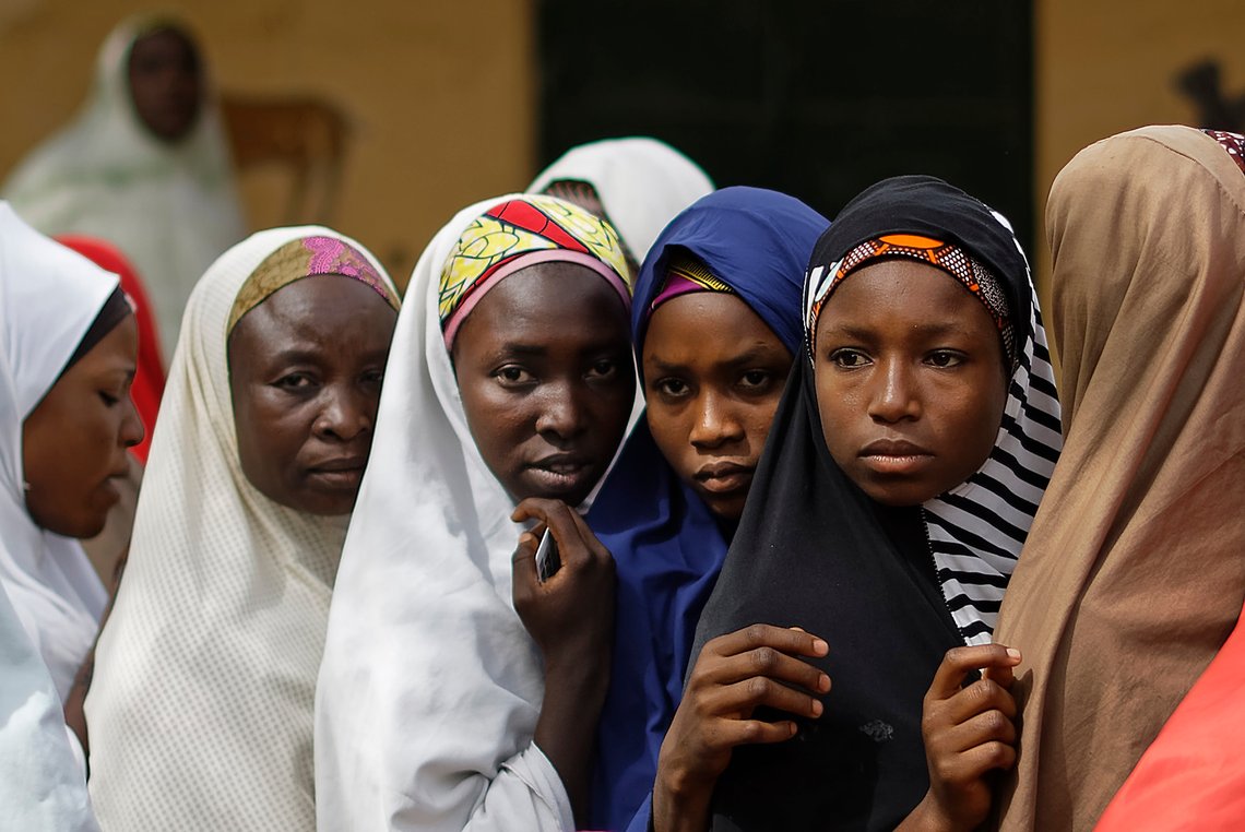 Women queue in line to cast their votes in the village of Tumfafi, near Kano, in northern Nigeria Saturday, Feb. 23, 2019. Nigerians are going to the polls for a presidential election Saturday, one week after a surprise delay for Africa's largest democracy. (AP Photo/Ben Curtis) Women queue in line to cast their votes in the village of Tumfafi, near Kano, in northern Nigeria Saturday, Feb. 23, 2019. Nigerians are going to the polls for a presidential election Saturday, one week after a surprise delay for Africa's largest democracy. (AP Photo/Ben Curtis)