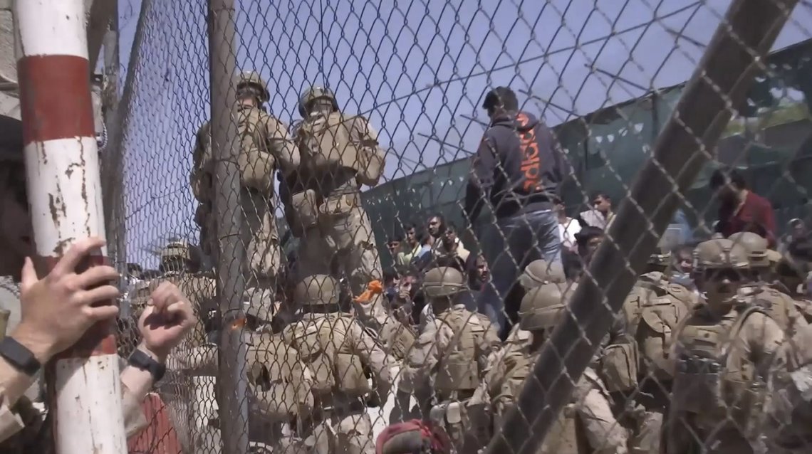 This image from a video released by the Department of Defense shows U.S. Marines at Abbey Gate before a suicide bomber struck outside Hamid Karzai International Airport on Aug. 26, 2021, in Kabul Afghanistan. The military investigation into the deadly attack during the Afghanistan evacuation has concluded that a suicide bomber, carrying 20 pounds of explosives packed with ball bearings, acted alone, and that the deaths of more than 170 Afghans and 13 U.S. service members were not preventable. (Department of Defense via AP) This image from a video released by the Department of Defense shows U.S. Marines at Abbey Gate before a suicide bomber struck outside Hamid Karzai International Airport on Aug. 26, 2021, in Kabul Afghanistan. The military investigation into the deadly attack during the Afghanistan evacuation has concluded that a suicide bomber, carrying 20 pounds of explosives packed with ball bearings, acted alone, and that the deaths of more than 170 Afghans and 13 U.S. service members were not preventable. (Department of Defense via AP)