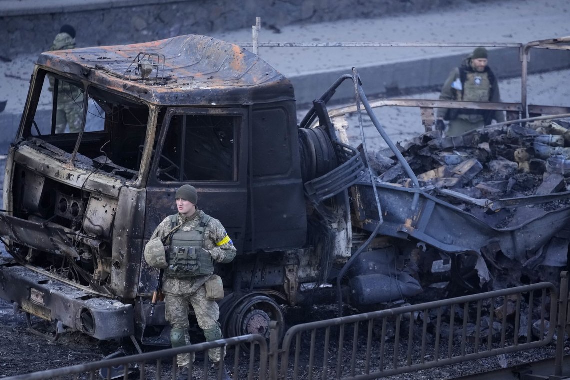 Ukrainian troops inspect the site following a Russian airstrike in Kyiv, Ukraine, Saturday, Feb. 26, 2022. (AP Photo/Vadim Ghirda) Ukrainian troops inspect the site following a Russian airstrike in Kyiv, Ukraine, Saturday, Feb. 26, 2022. (AP Photo/Vadim Ghirda)