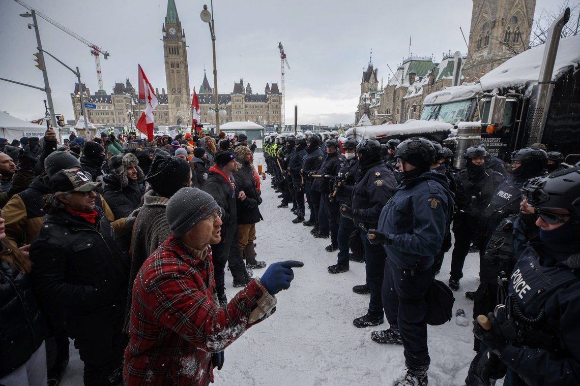 Police move in to clear protesters from downtown Ottawa near Parliament Hill on Saturday, Feb. 19, 2022. Police resumed pushing back protesters on Saturday after arresting more than 100 and towing away vehicles in Canada’s besieged capital, and scores of trucks left under the pressure, raising authorities’ hopes for an end to the three-week protest against the country’s COVID-19 restrictions. (Cole Burston /The Canadian Press via AP) Police move in to clear protesters from downtown Ottawa near Parliament Hill on Saturday, Feb. 19, 2022. Police resumed pushing back protesters on Saturday after arresting more than 100 and towing away vehicles in Canada’s besieged capital, and scores of trucks left under the pressure, raising authorities’ hopes for an end to the three-week protest against the country’s COVID-19 restrictions. (Cole Burston /The Canadian Press via AP)